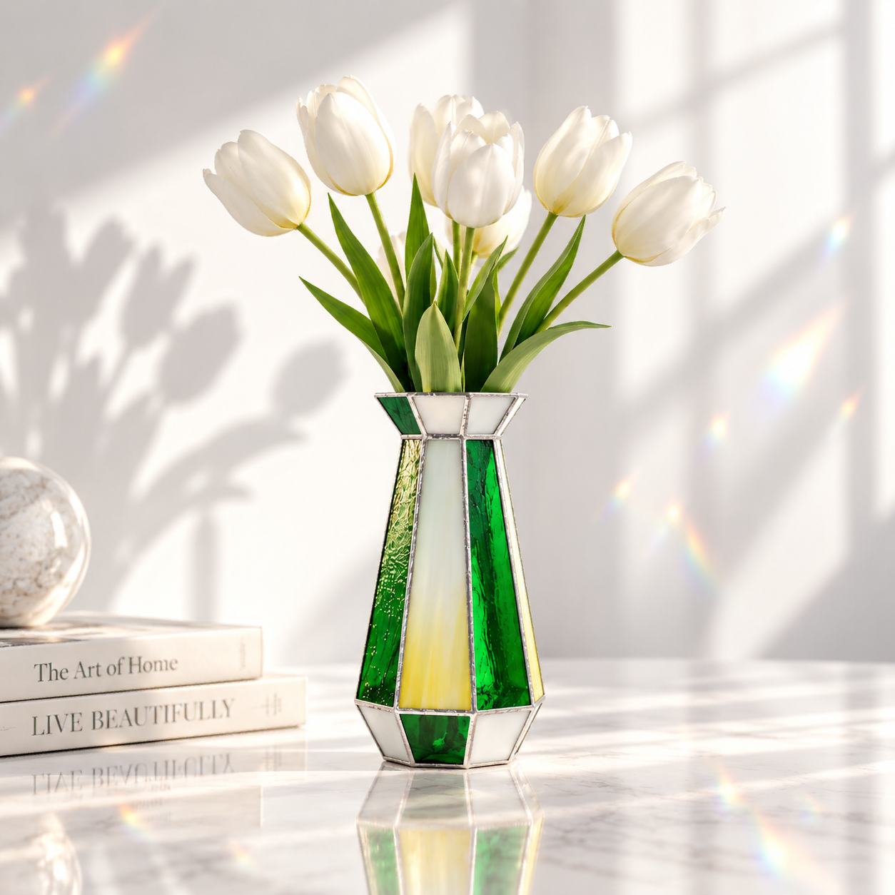 Soft Geometry by Marie ART Gallery — a Tiffany-style stained glass vase in white, yellow, and green, holding fresh white tulips on a sunlit marble windowsill.