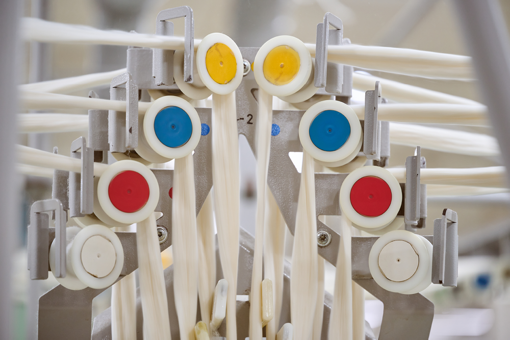 Medical or laboratory equipment with multiple colorful buttons and levers, possibly part of a medical device or instrument.