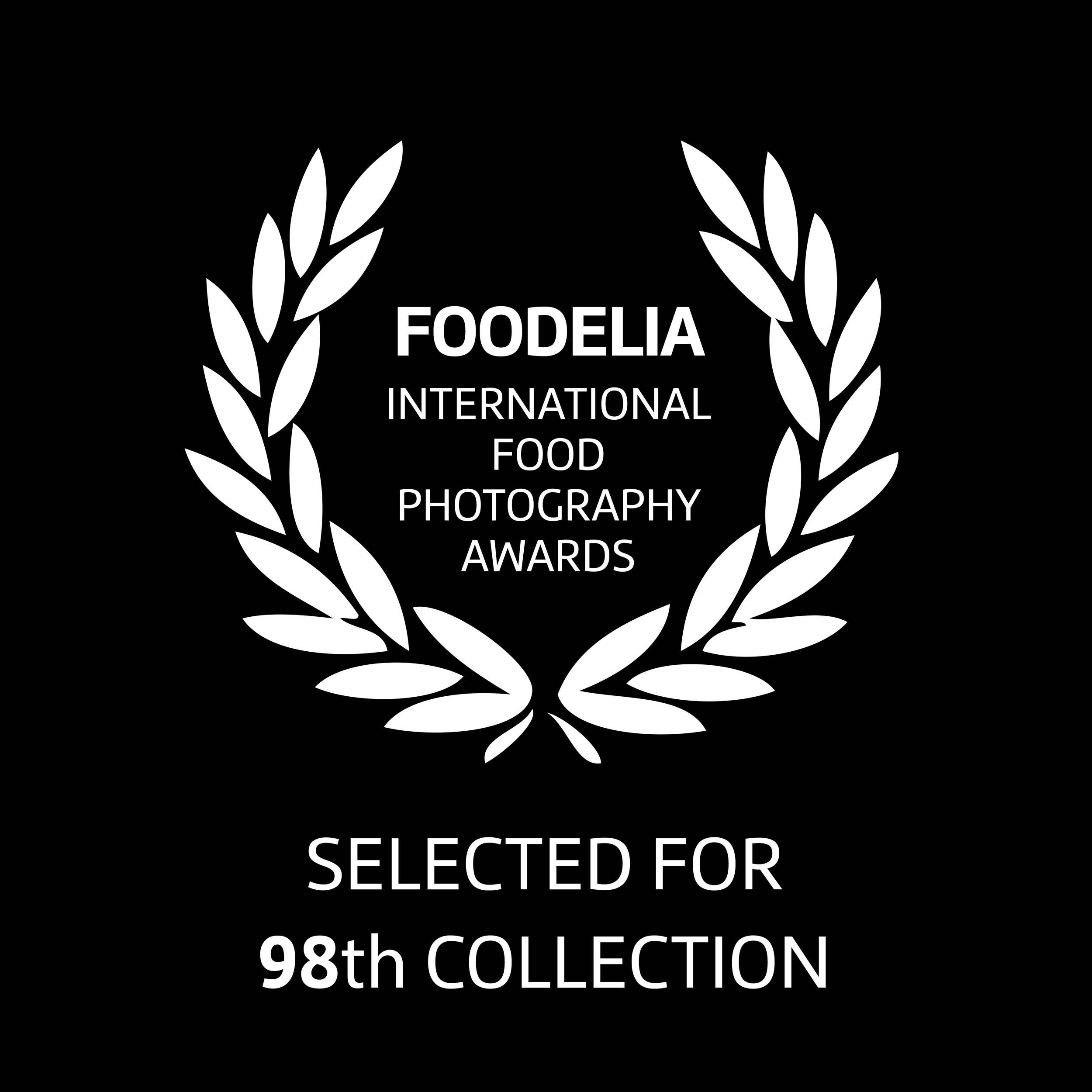Award plaque for FOOdelia International Food Photography Awards, selected for 98th Collection, with white laurel wreath on black background.