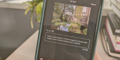 Photo of a phone screen showing a phot of trees and a ruined building, with the option to add alt text to the image.