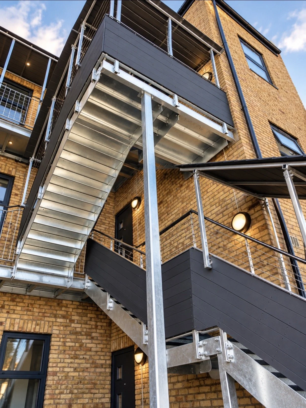 multi-storey fire escape and steel roof. access steel staircase. commercial steel project. UK