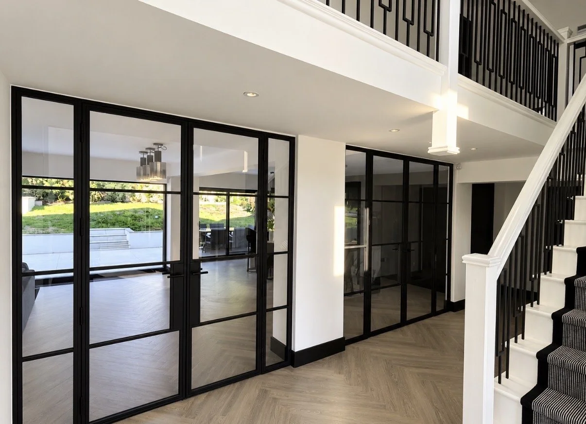 Modern double steel door in residential property. Glass panelled steel doors, installed by Mammoth Steel throughout the UK