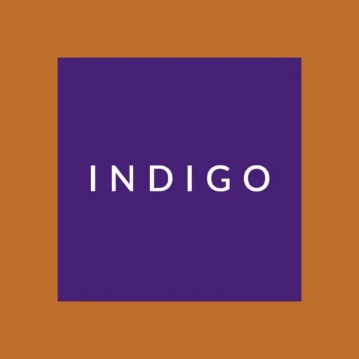 The word 'INDIGO' written in white inside a purple square on a brown background.