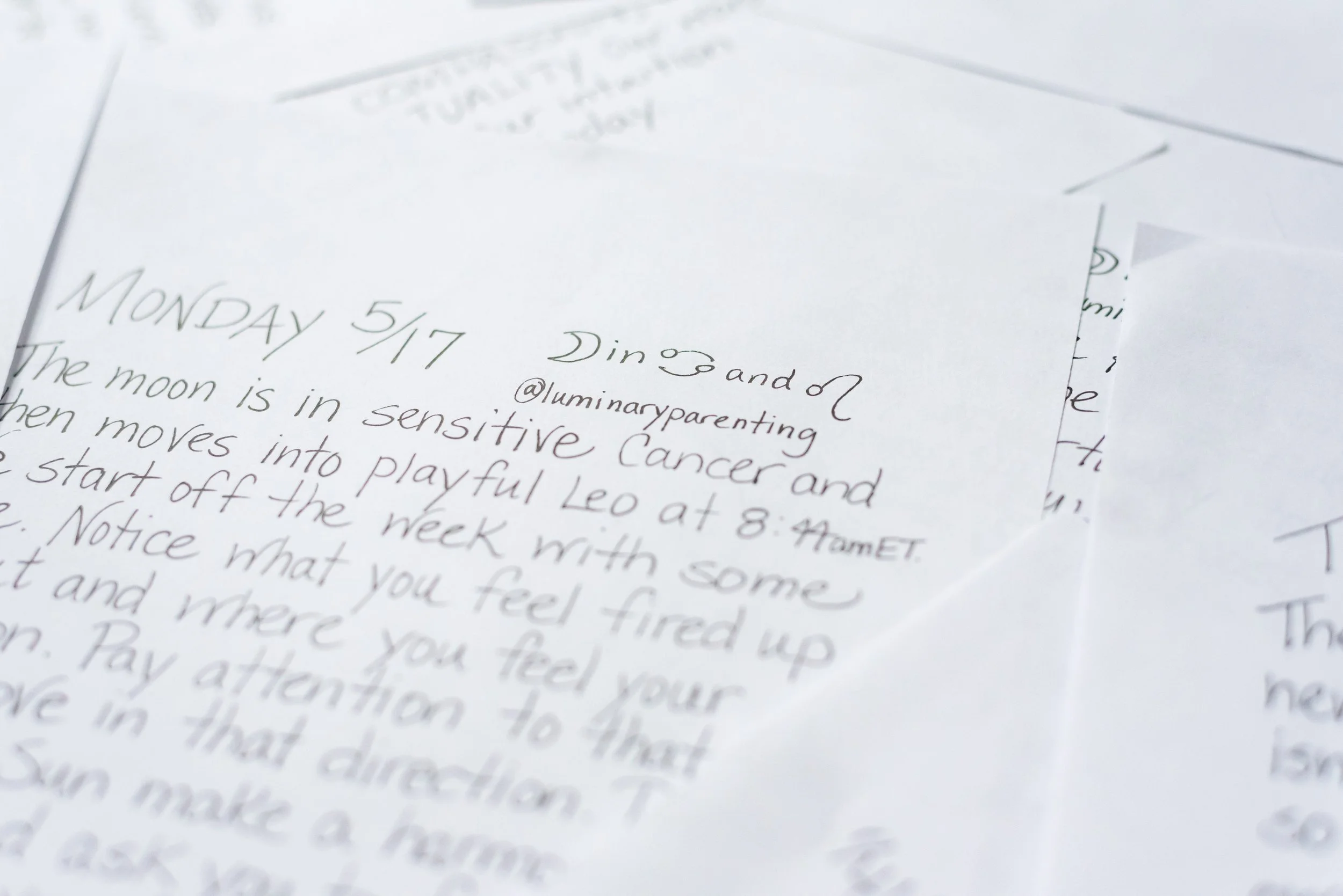 Weekly Cosmic Weather, handwritten notes on white paper, with visible text about the moon being in sensitive Cancer and the start of the week.