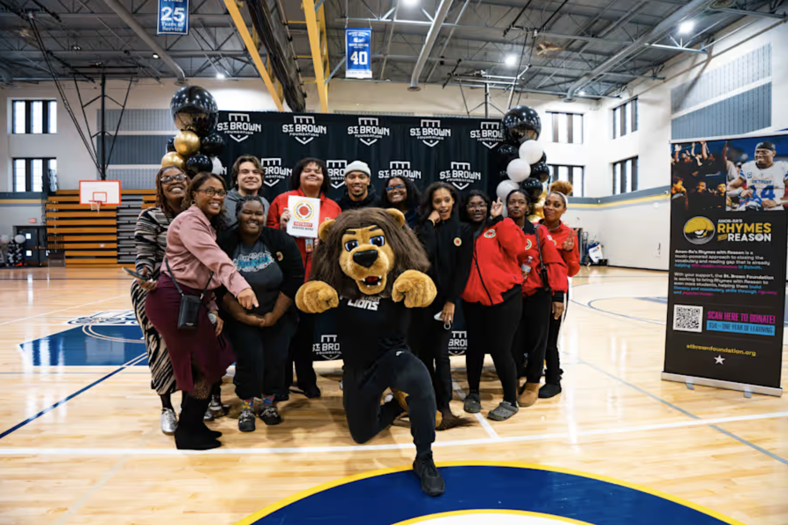 Amon-Ra St. Brown delivers school supplies to Detroit students