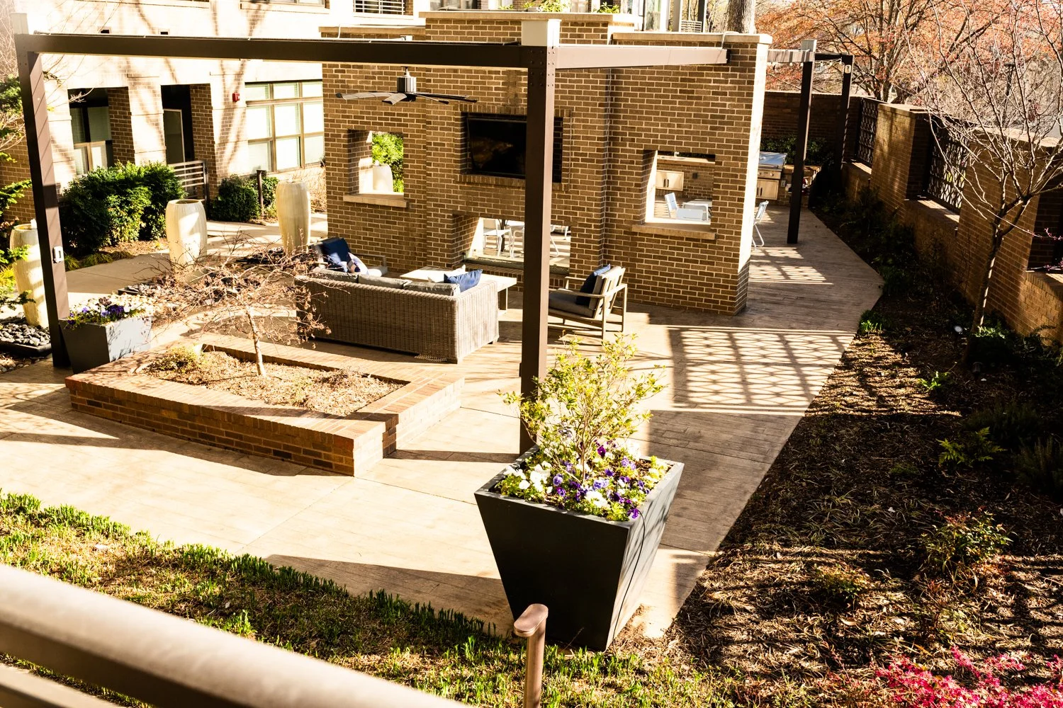 Outdoor patio area with seating and plants