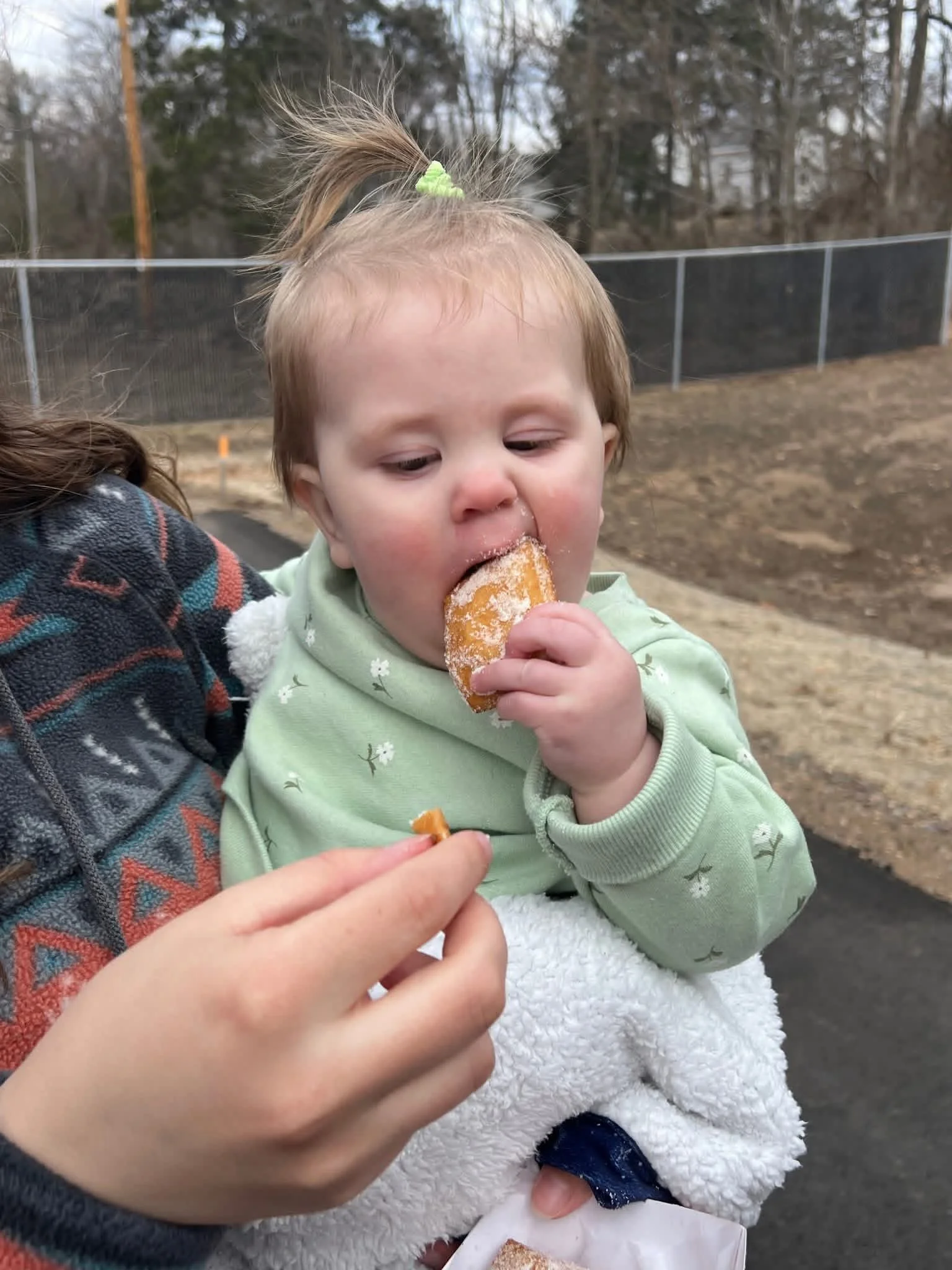 Customer taste checking the Beignets!