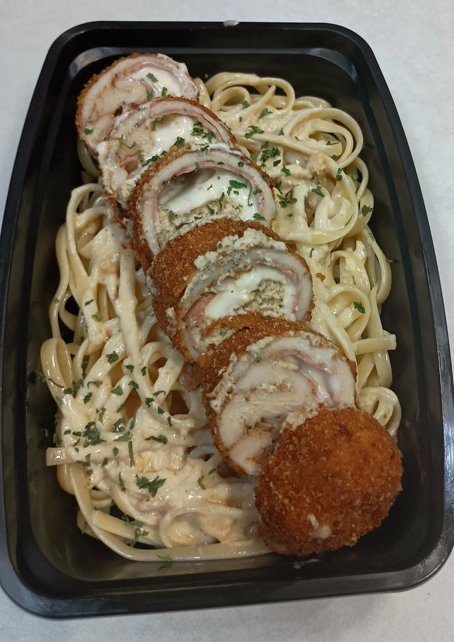 Chicken Cordon Bleu on a lemon herb Fettucine pasta.
