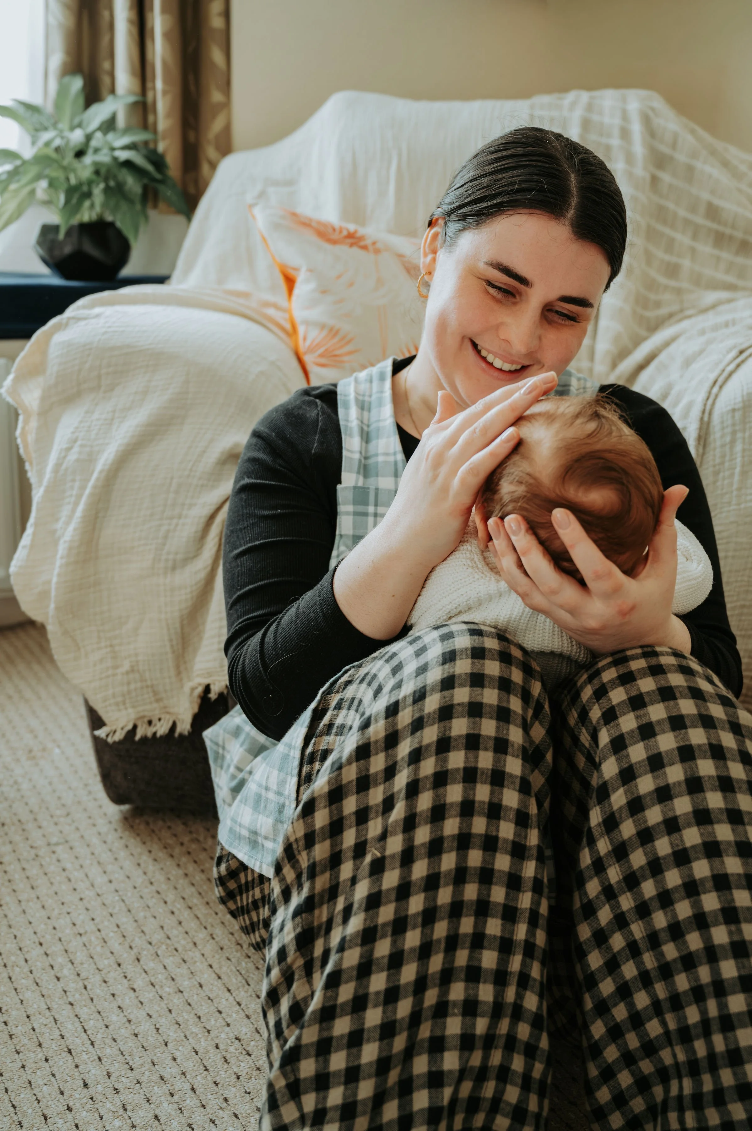 Simple line drawing of a sprouting plant with leaves, a curled stem, and roots.