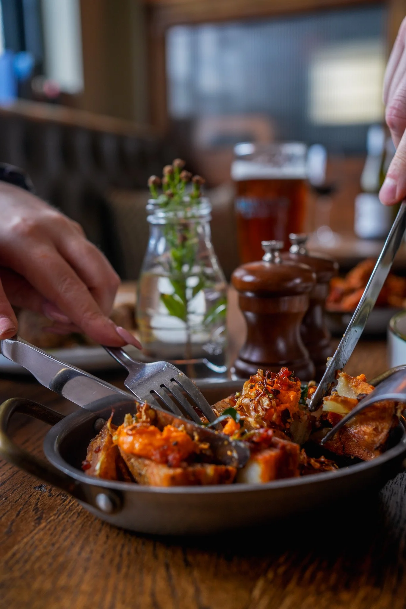 Crispy layered potato starter being enjoyed at The Thatched Inn in West Sussex.