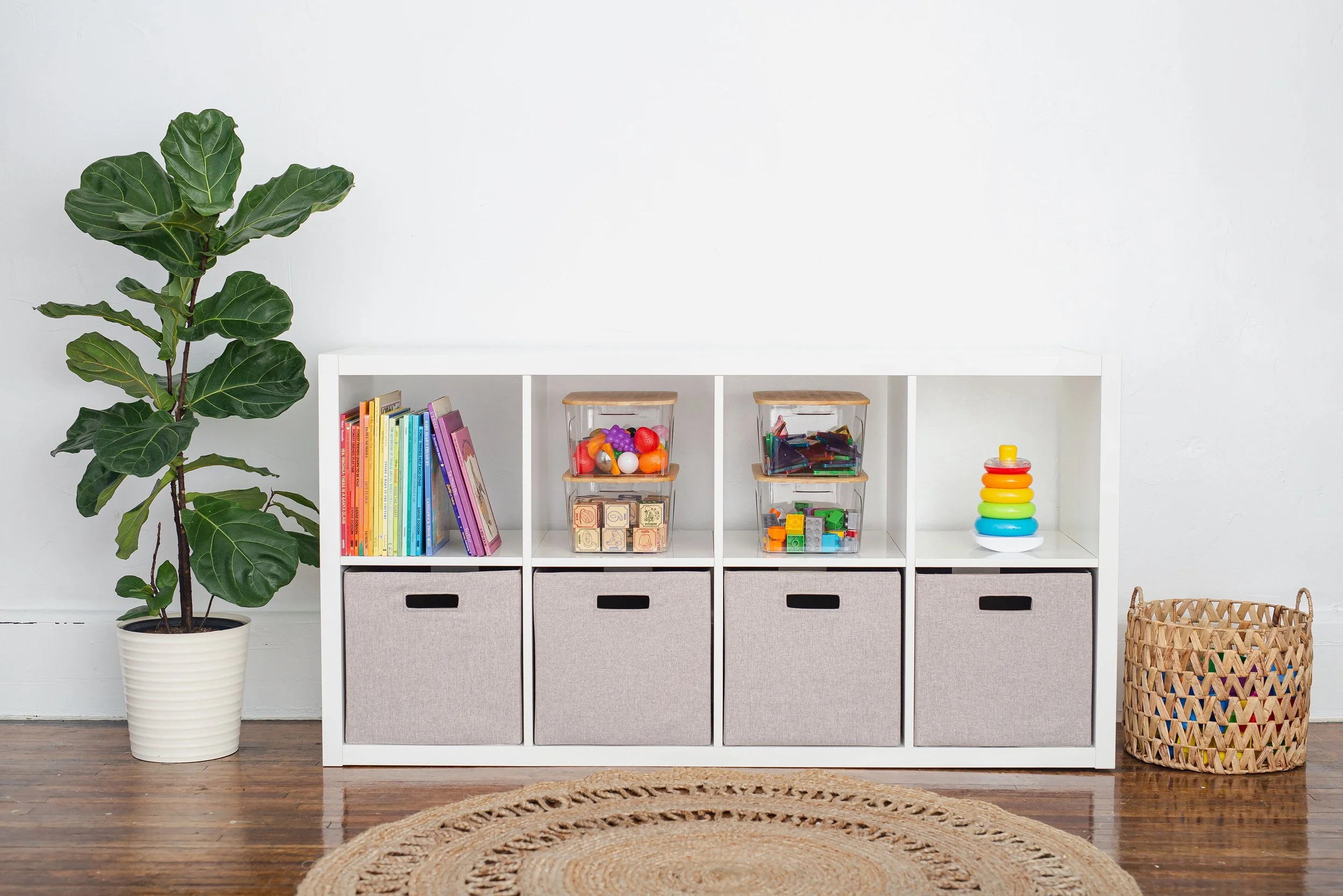 cube storage system with rainbow colored toys organized in gray bins