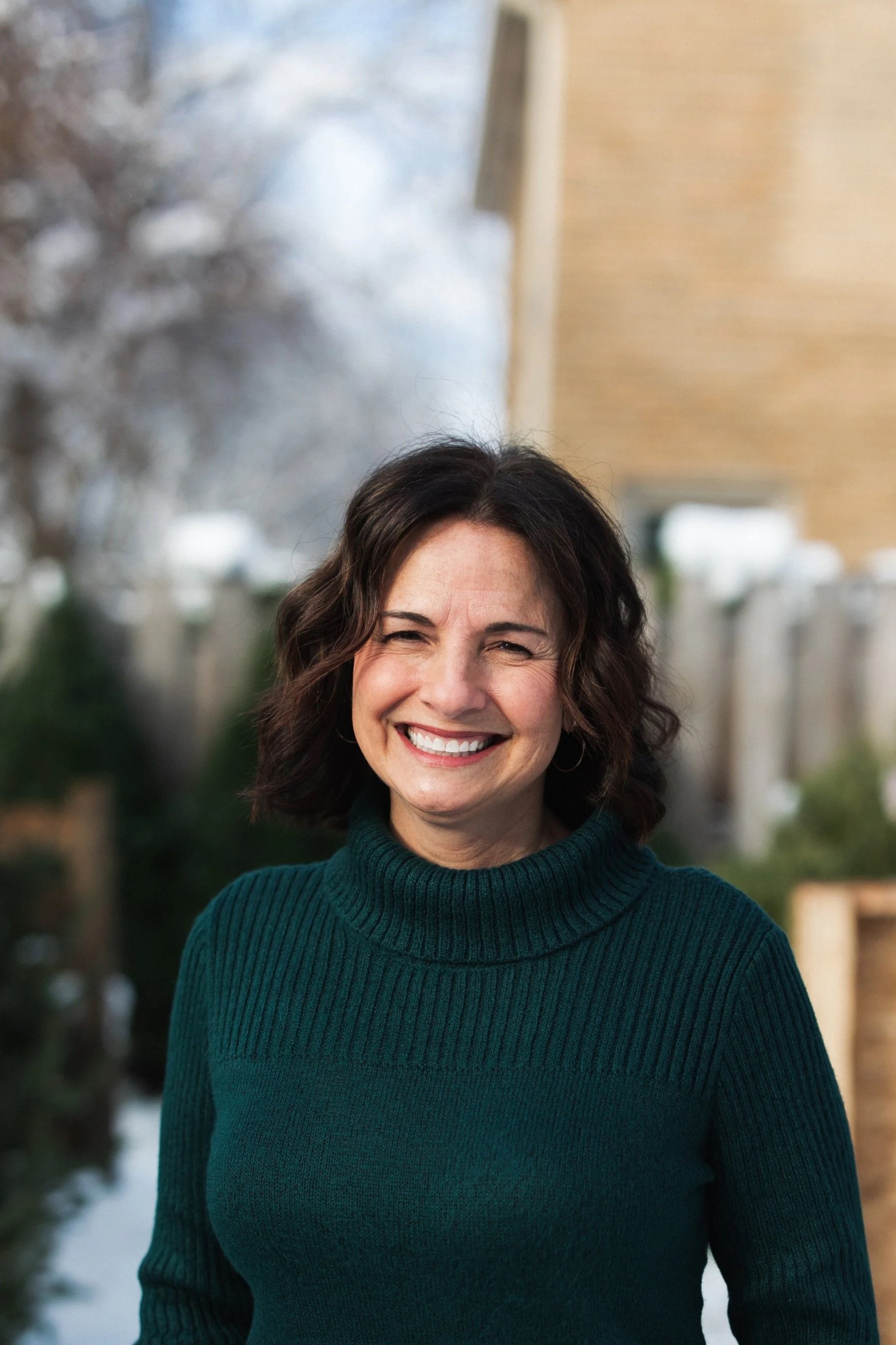Home organizer Colleen standing outside and smiling