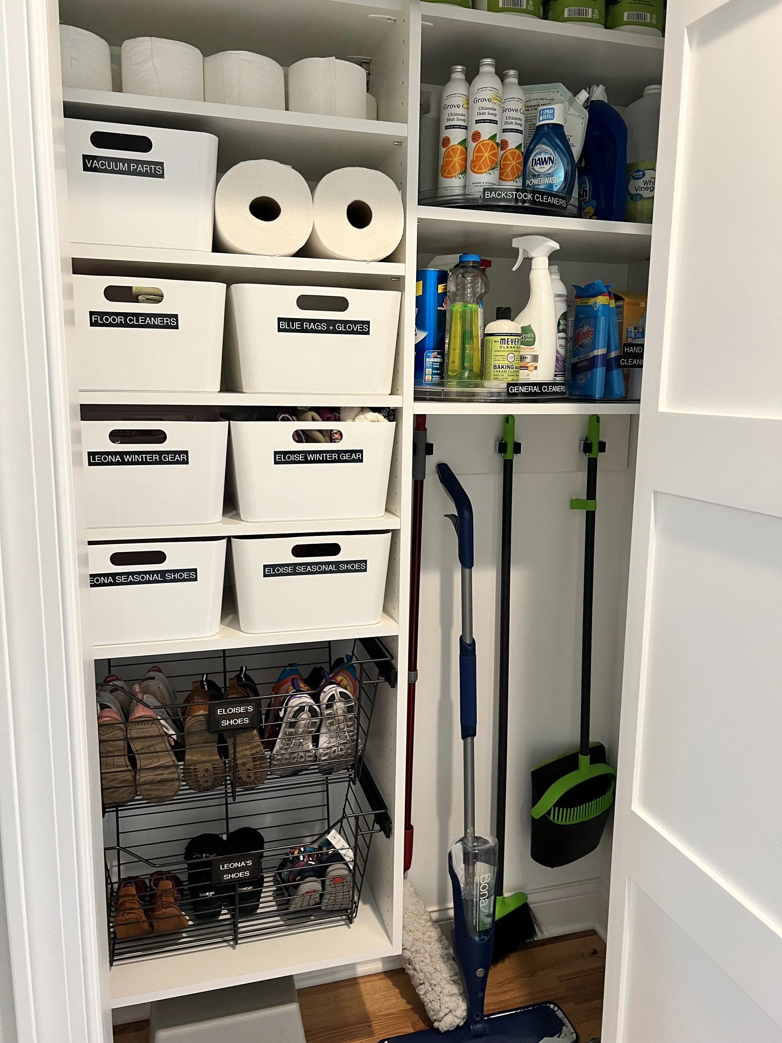 White containers with black labels in a cleaning closet