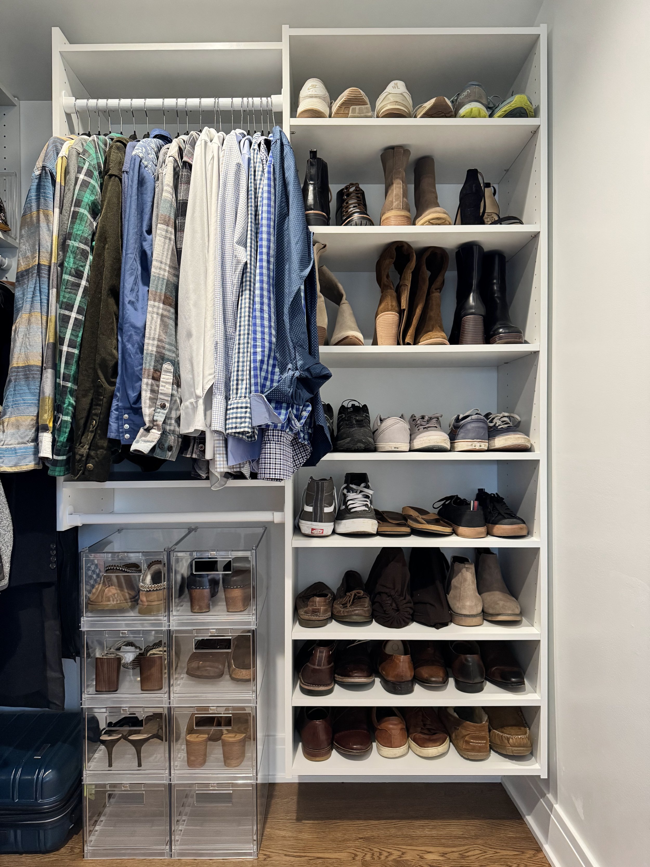 White modular closet with organized shoes on shelves and acrylic shoe boxes