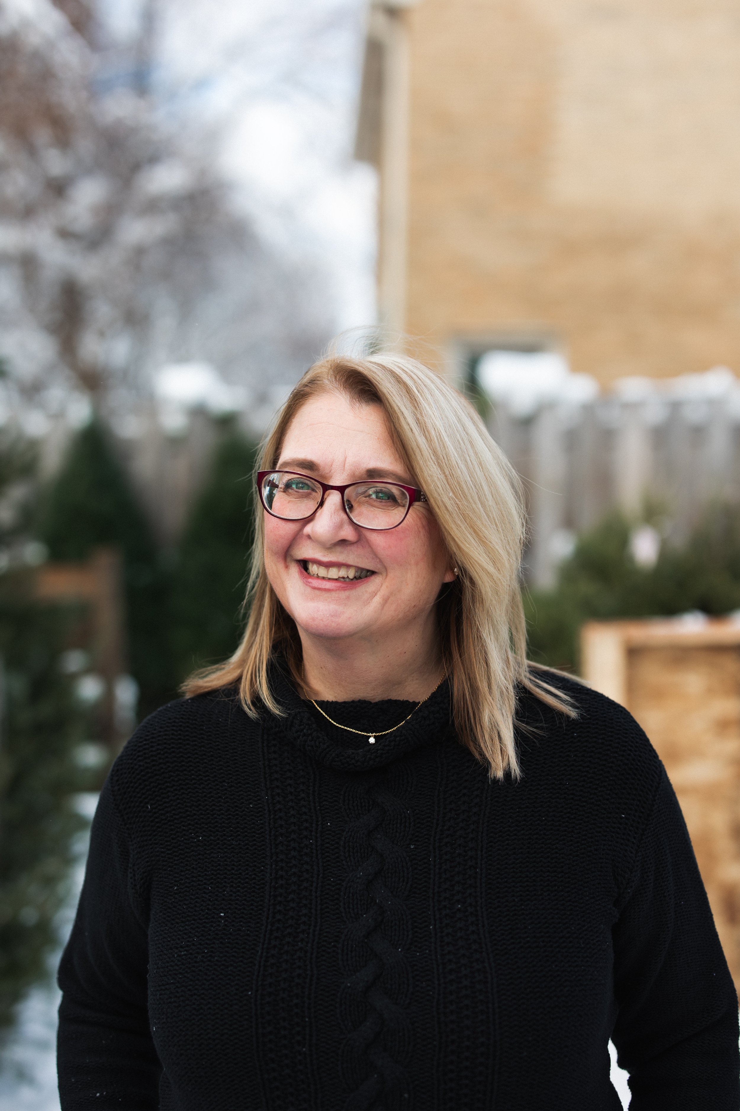 Home organizer Colleen standing outside and smiling