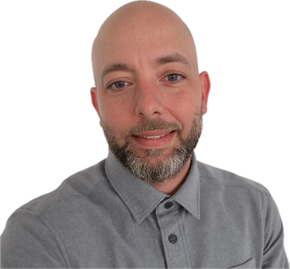 Bald man with beard wearing a gray button-up shirt