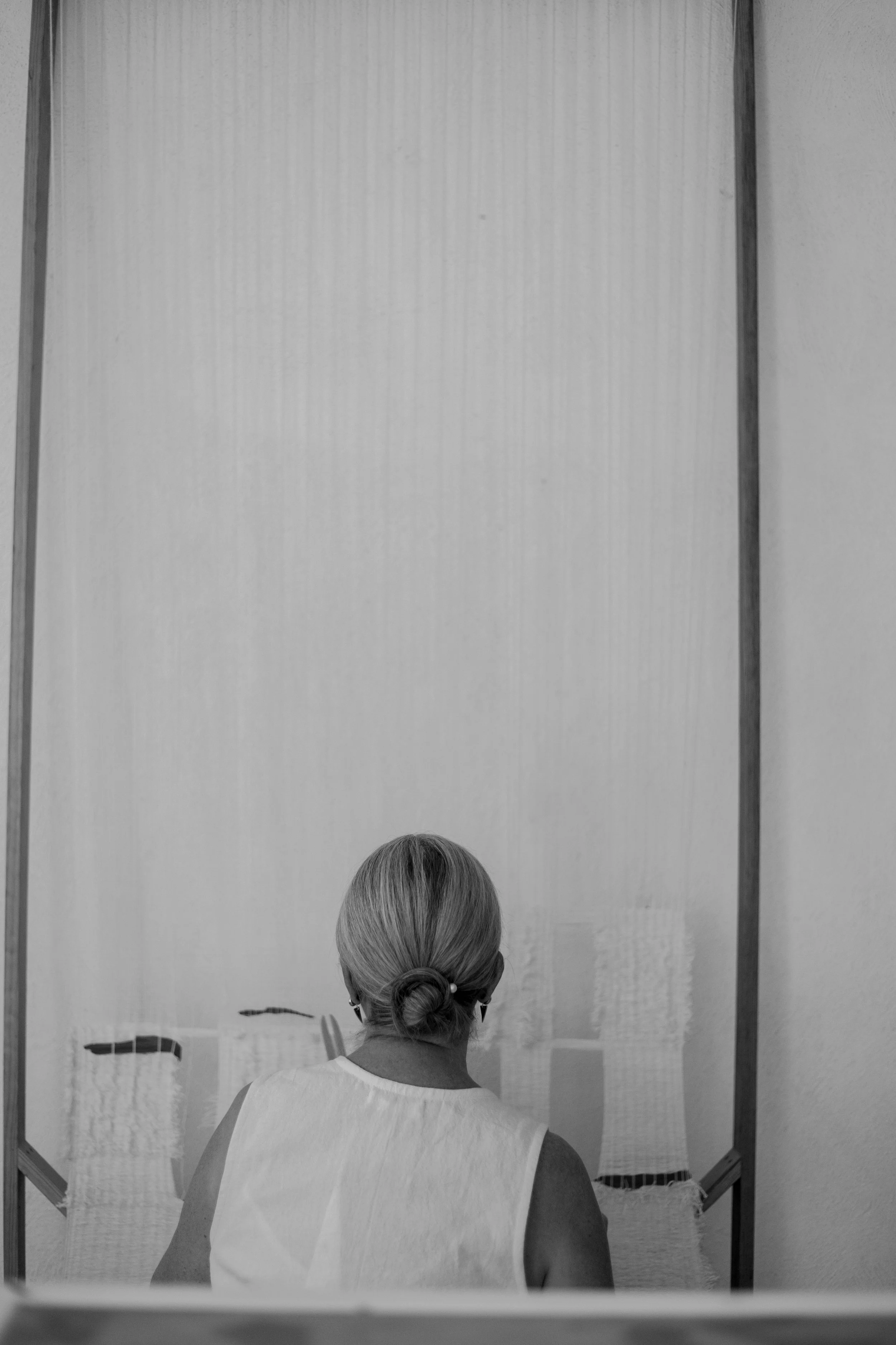 Oaxaca based contemporary textile artist christina hattler at her studio weaving a tapestry