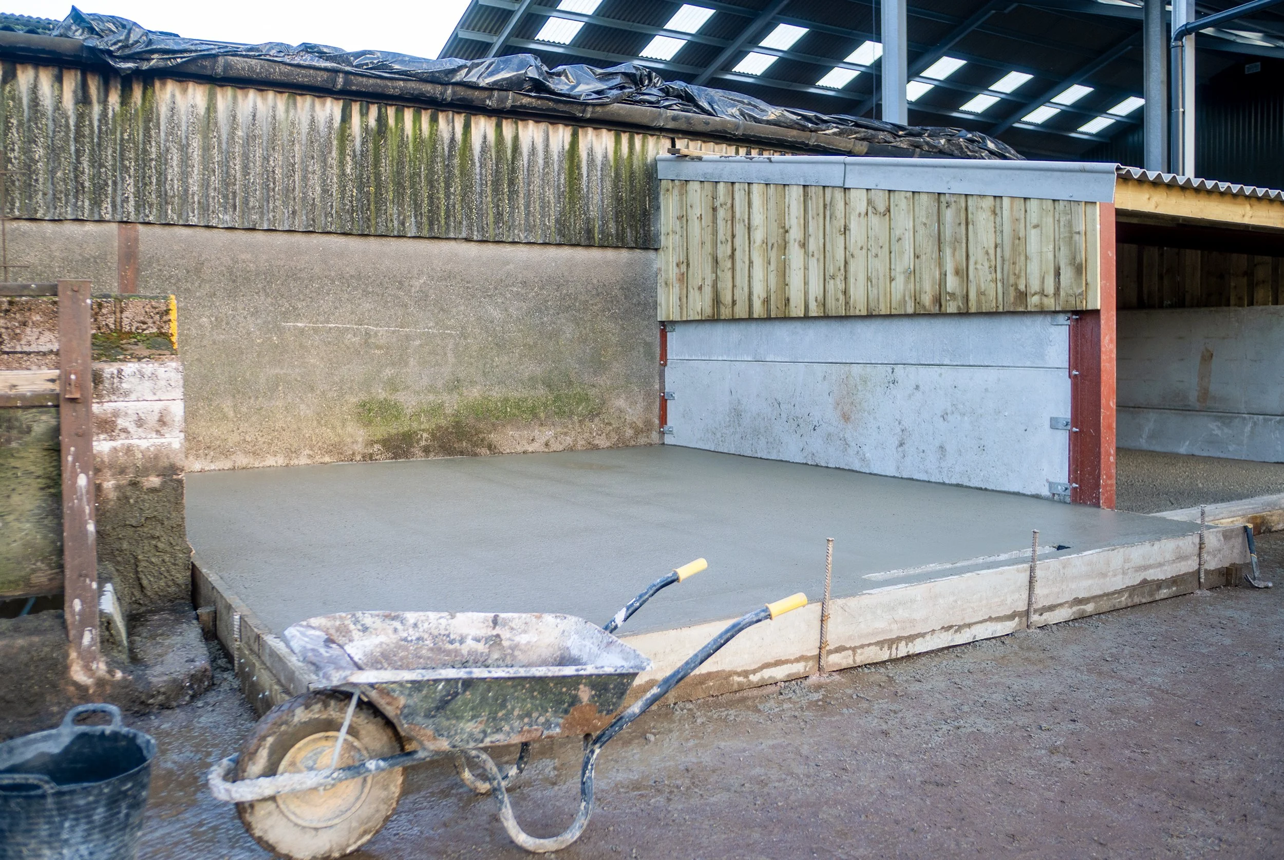 Freshly poured concrete slab for a new dairy installation on a Somerset dairy farm ready to hold a 15,000 litre DeLaval bulk milk tank.