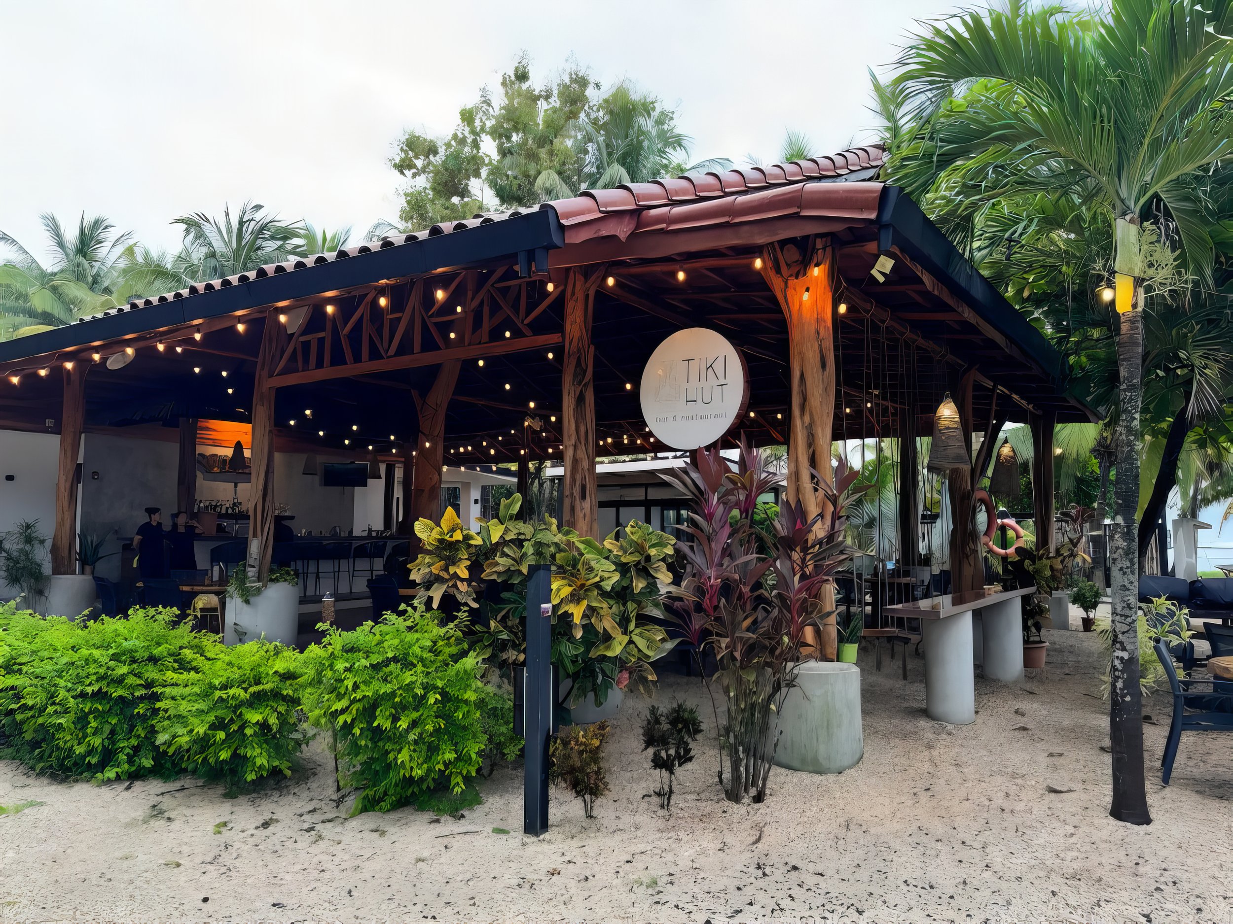 Tiki Hut offers a relaxed menu inspired by beach life, featuring breakfast options, fresh dishes, burgers, tacos, bowls, and refreshing drinks.