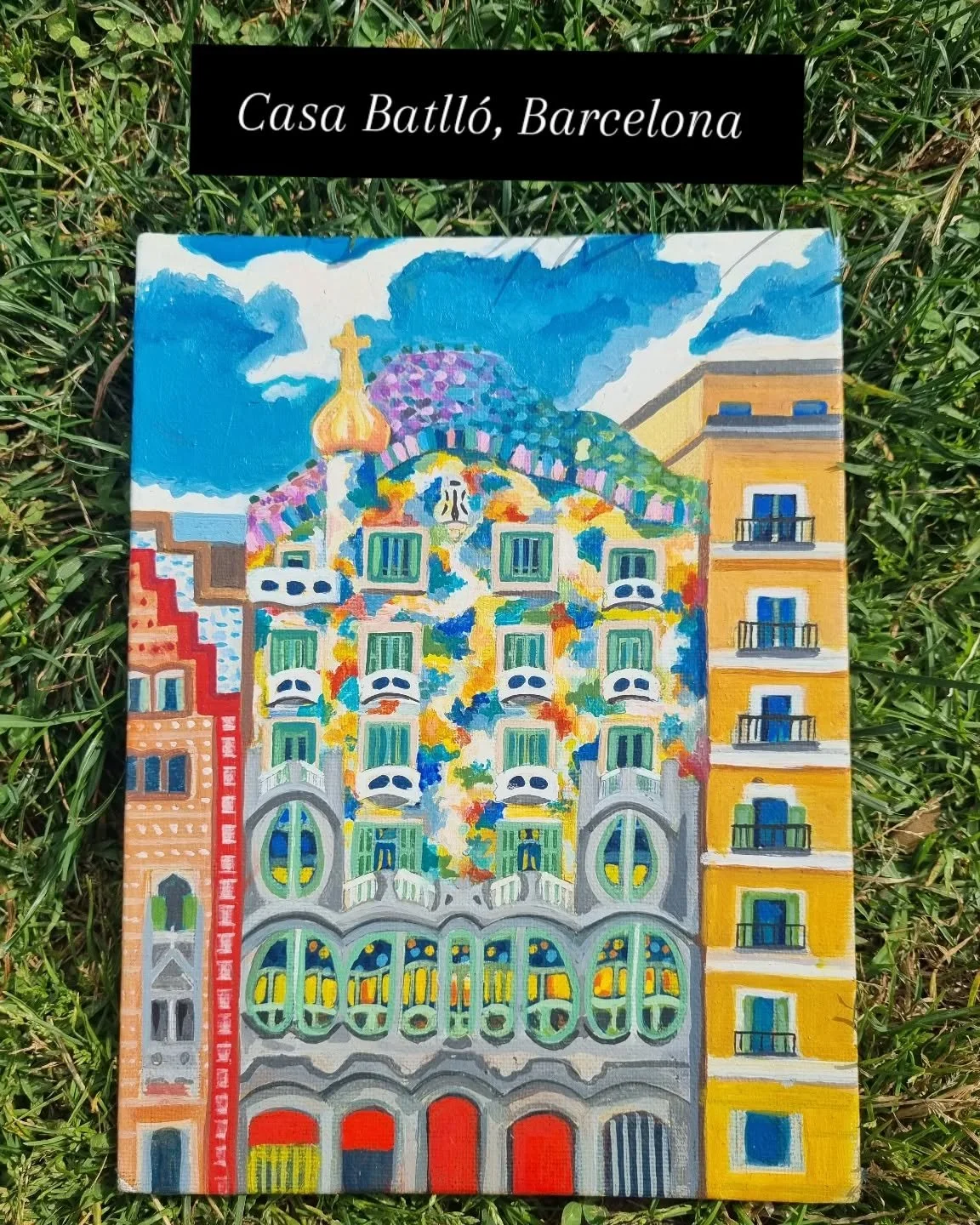 Designed by Antoni Gaudi in modernisme architectural style. The building is located on Passeig de Gracia. Its style employs organic lines and trencad&iacute;s which is a layering of ceramic tiles over mortar. The building is infused with colour, text