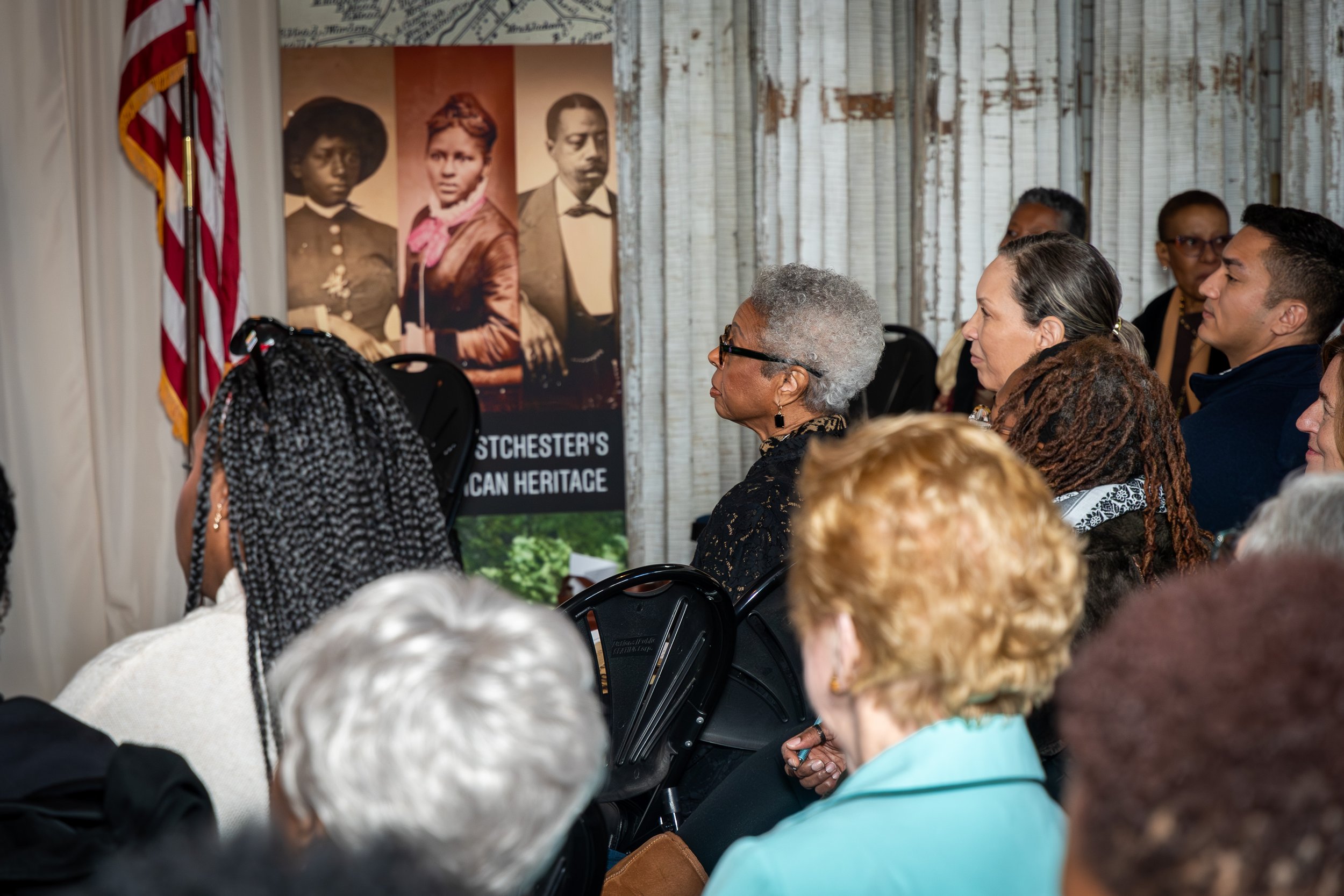 2025 Literary Celebration, guests attentively listening.