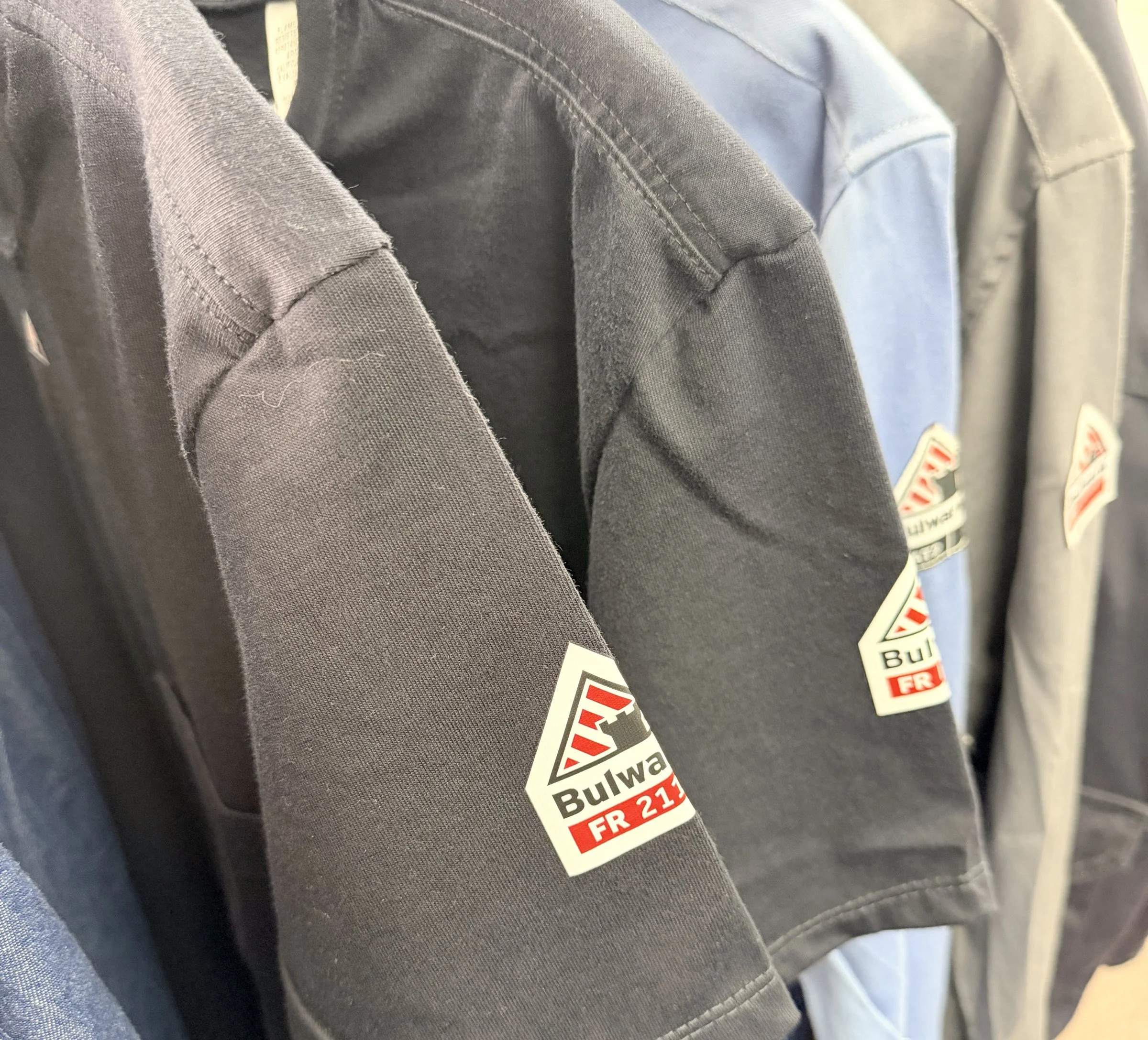 Bulwark flame-resistant work shirts on the rack at Uniforms & More