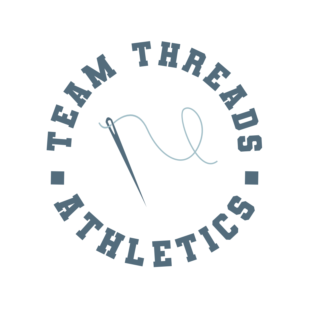 Circular logo with text 'TEAM THREADS ATHLETICS' around the circle, featuring a stylized thread and needle at the center.