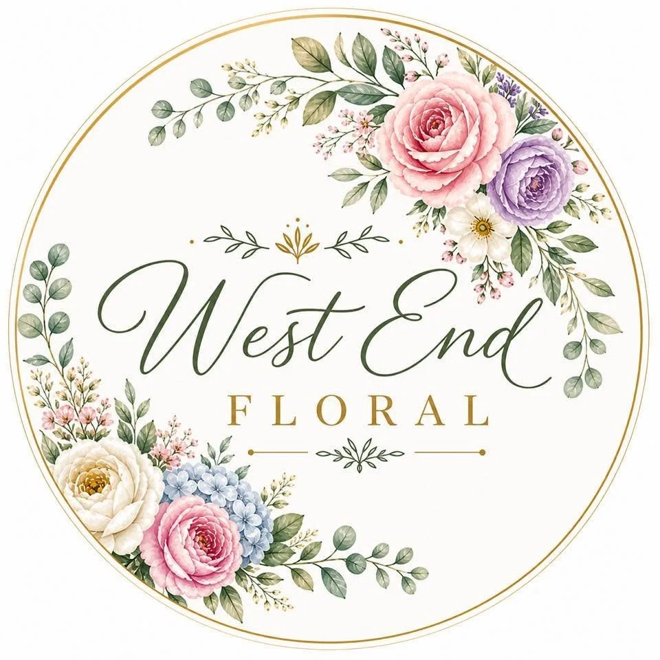 A round floral logo for West End Floral featuring pink, purple, white, and blue flowers with green leaves and gold accents.