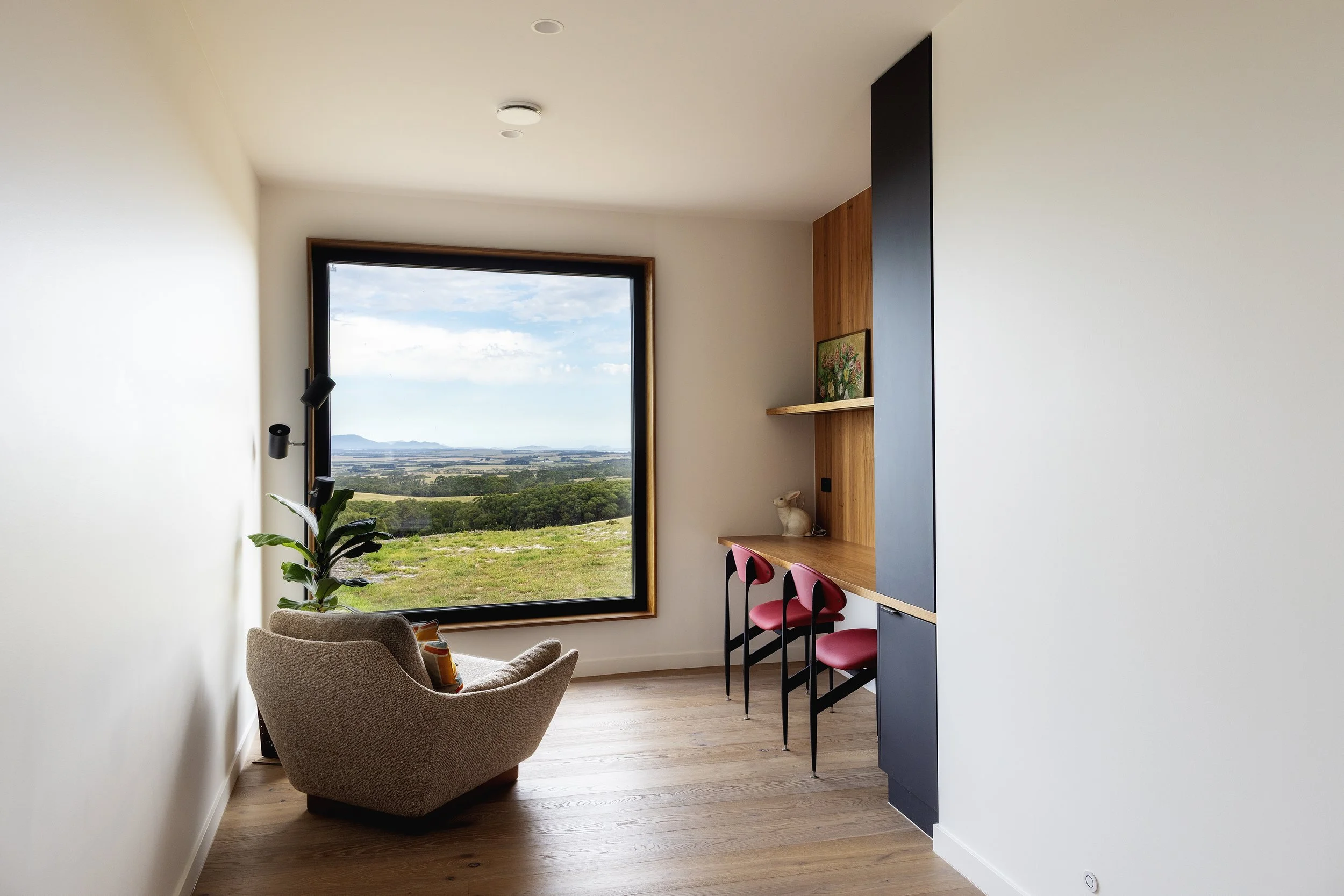 Study in Passive House in Foster, Victoria. Showing rolling hills view outside of window.