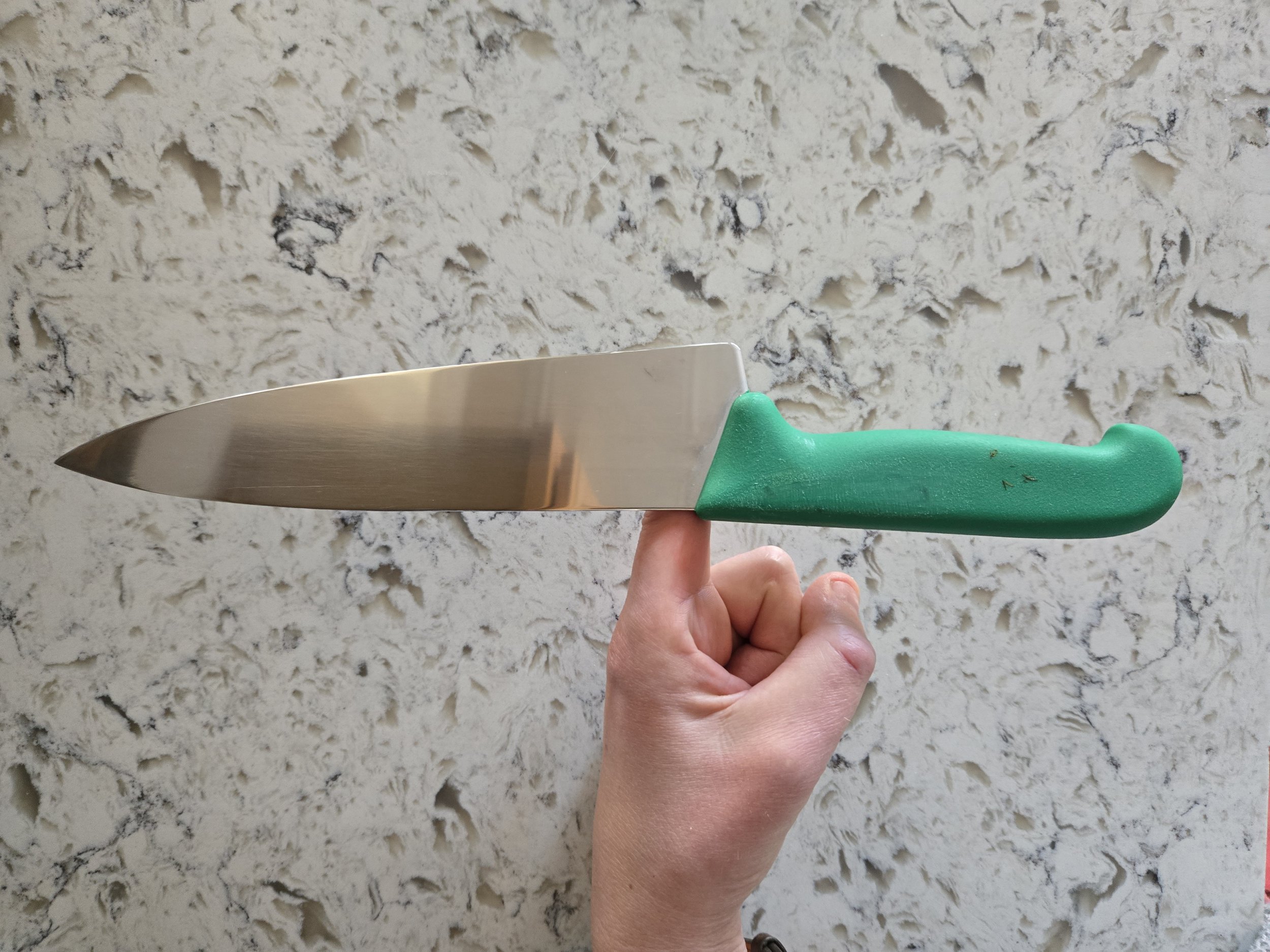 a knife available to rent from SImply Sharp balanced at the end of the handle