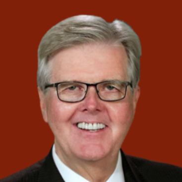 A smiling middle-aged man with gray hair and glasses, wearing a black suit and tie, against a red background.