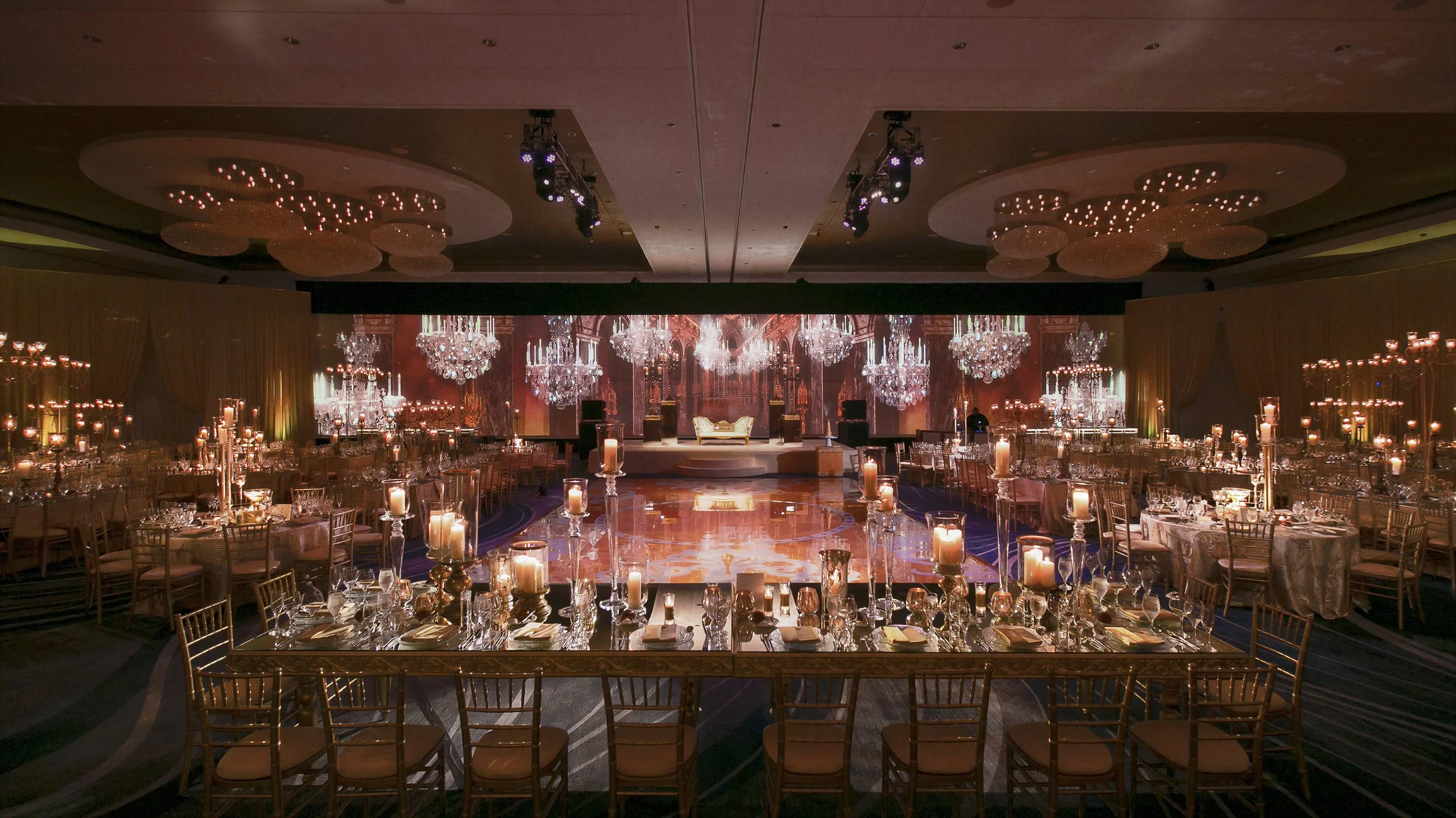 Versailles Hall of Mirrors themed wedding reception created with a 100-foot wide rear projection screen and rotating chandelier visuals in Chicago by Samson Productions
