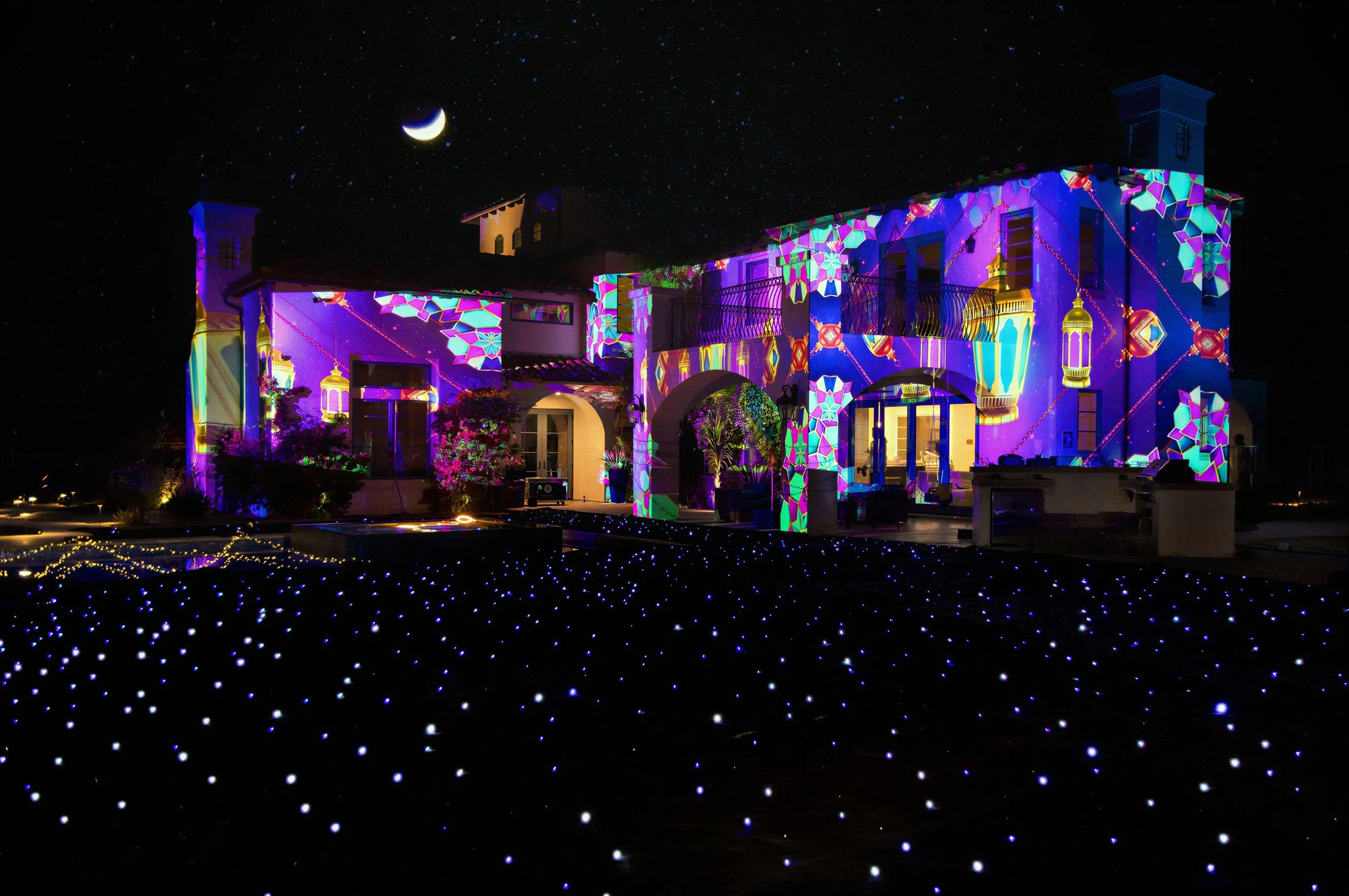 Architectural projection mapping on a luxury home in Agoura Hills, Los Angeles with LED star drape and holiday visuals created for the Anazala Family by Samson Productions