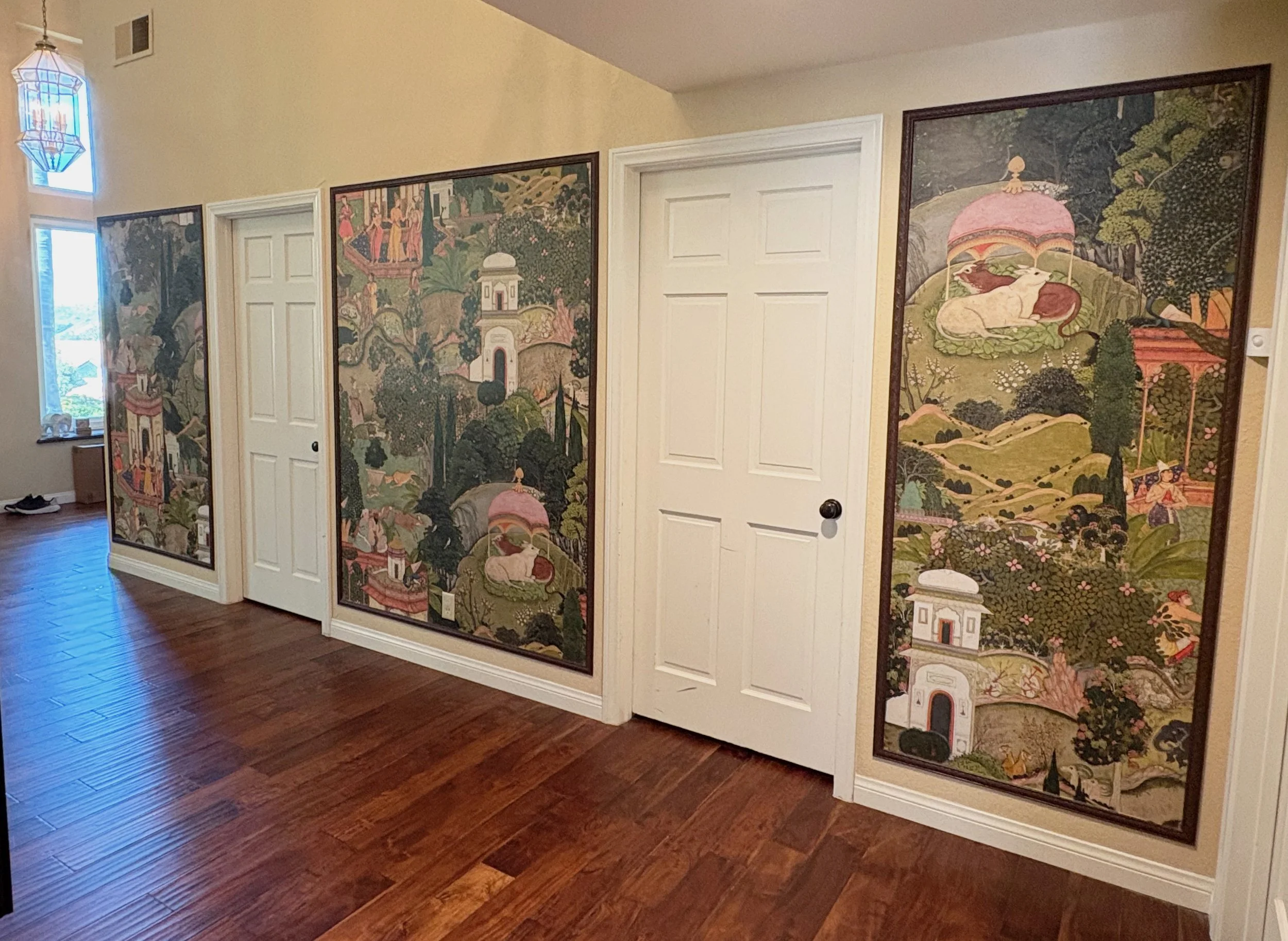 South Asian Formal Entry refresh with Ruggable Kavi Rug, Arhaus benches and Finley cabinet. Design by Haveli Designs in Colorado. Features Mind The Gap wallpaper as murals and embossed trim