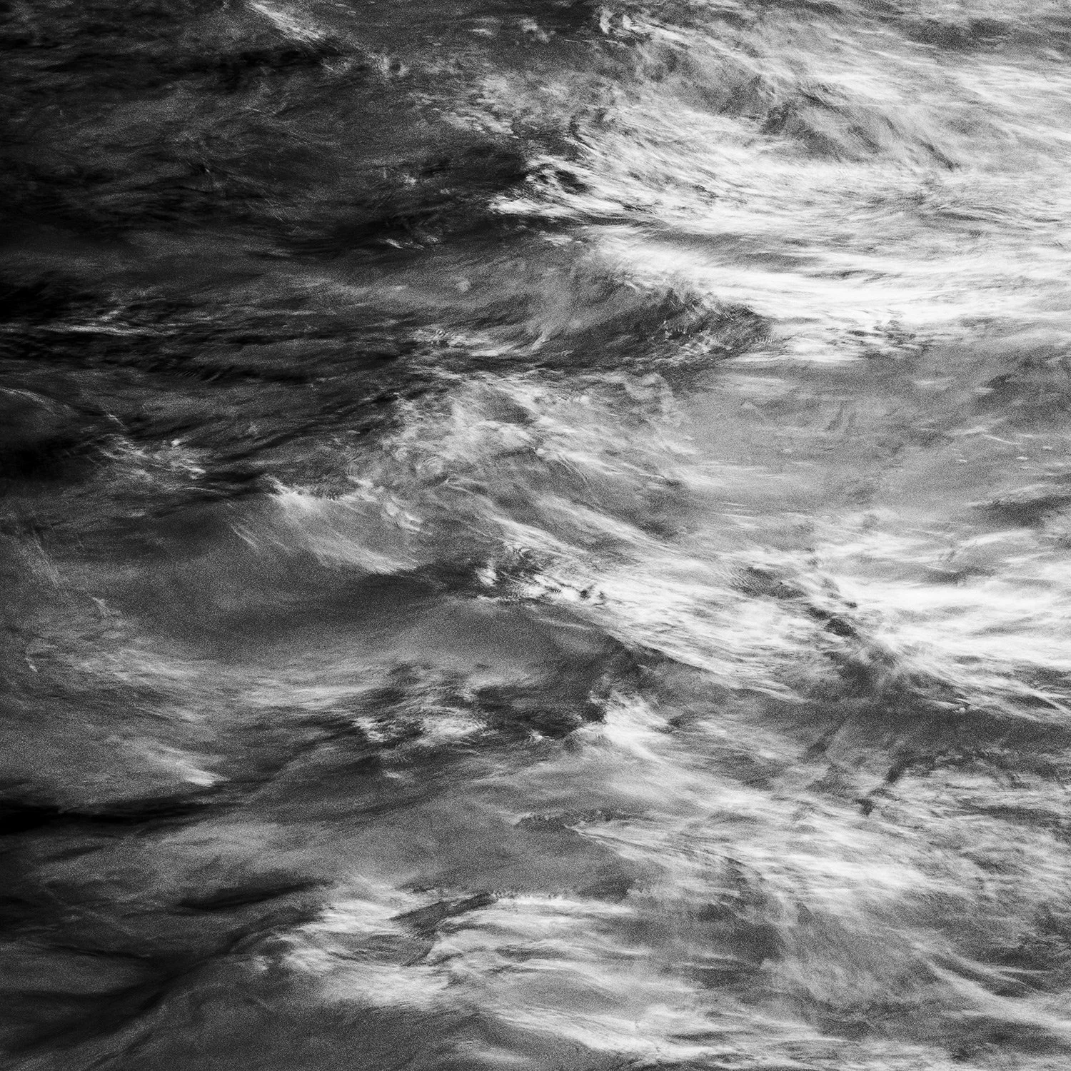 Black and white photography of the sea with waves moving in Azores