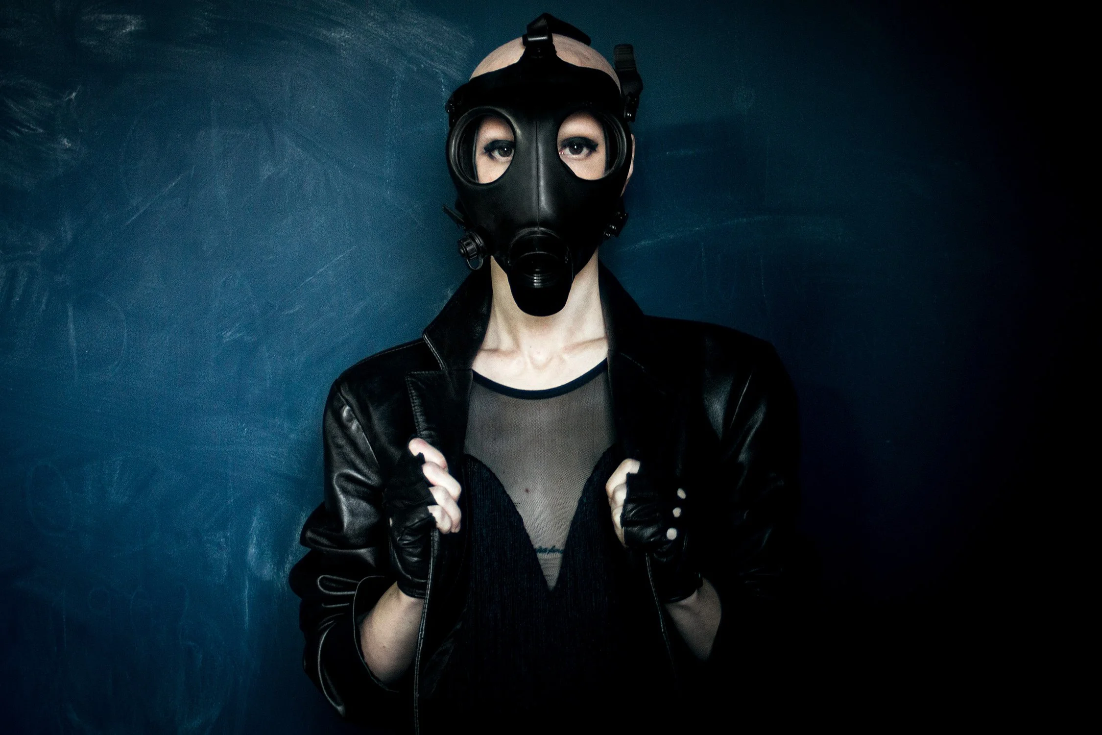 Fashion editorial dark and fetishistic with black leather and gas mask