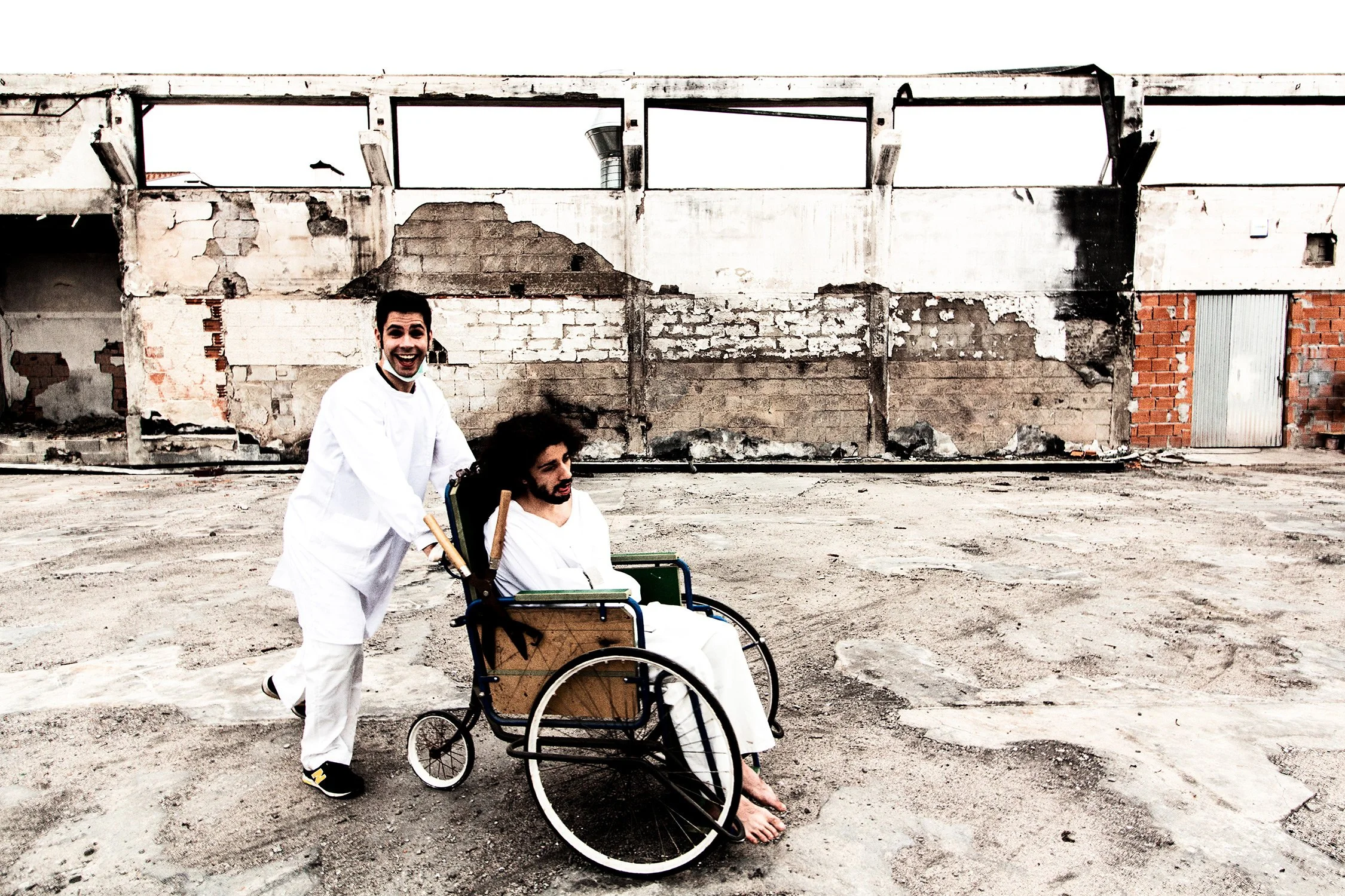 Narrative and funny press photography with a wheelchair in a burned factory for nu-metal portuguese band Lendfall