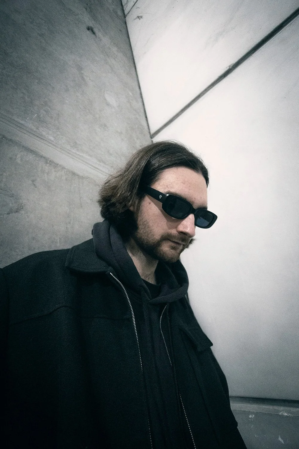 Press photography for drum'n'bass producer with brutalist scenario