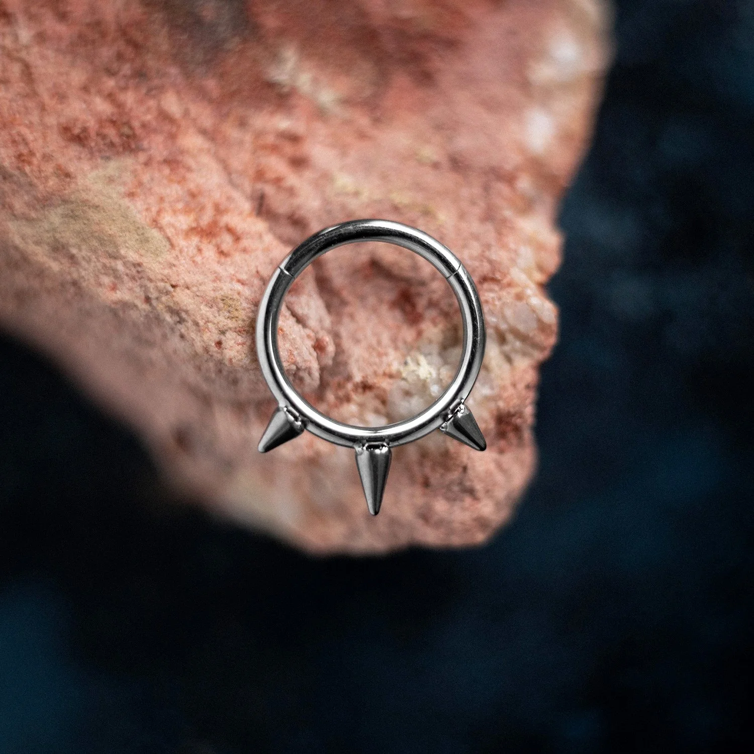Moody product photography with piercing jewelry