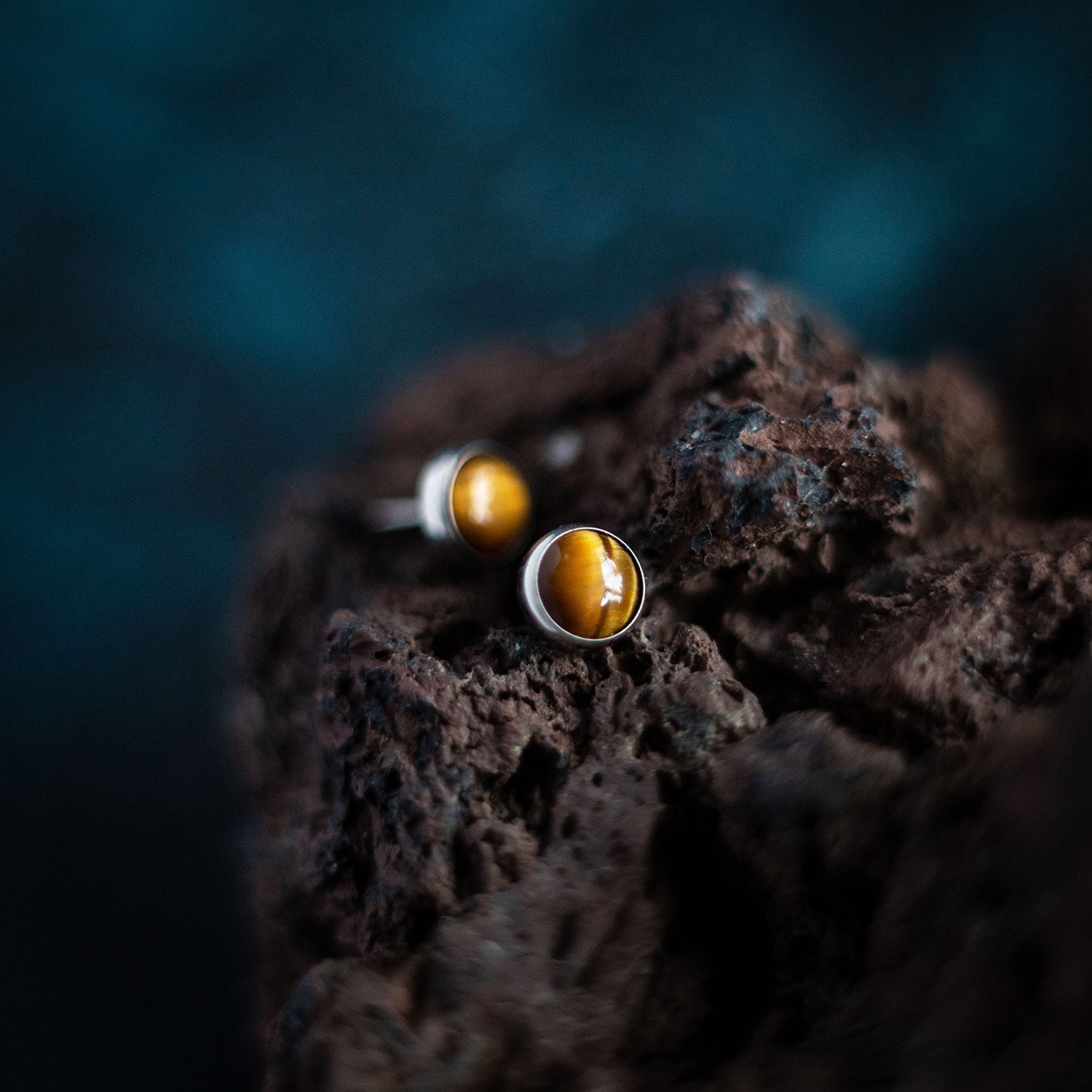Moody product photography with piercing jewelry