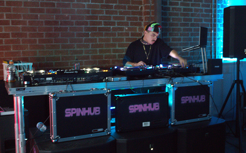 A DJ warehouse show using SpinHub Rentals equipment