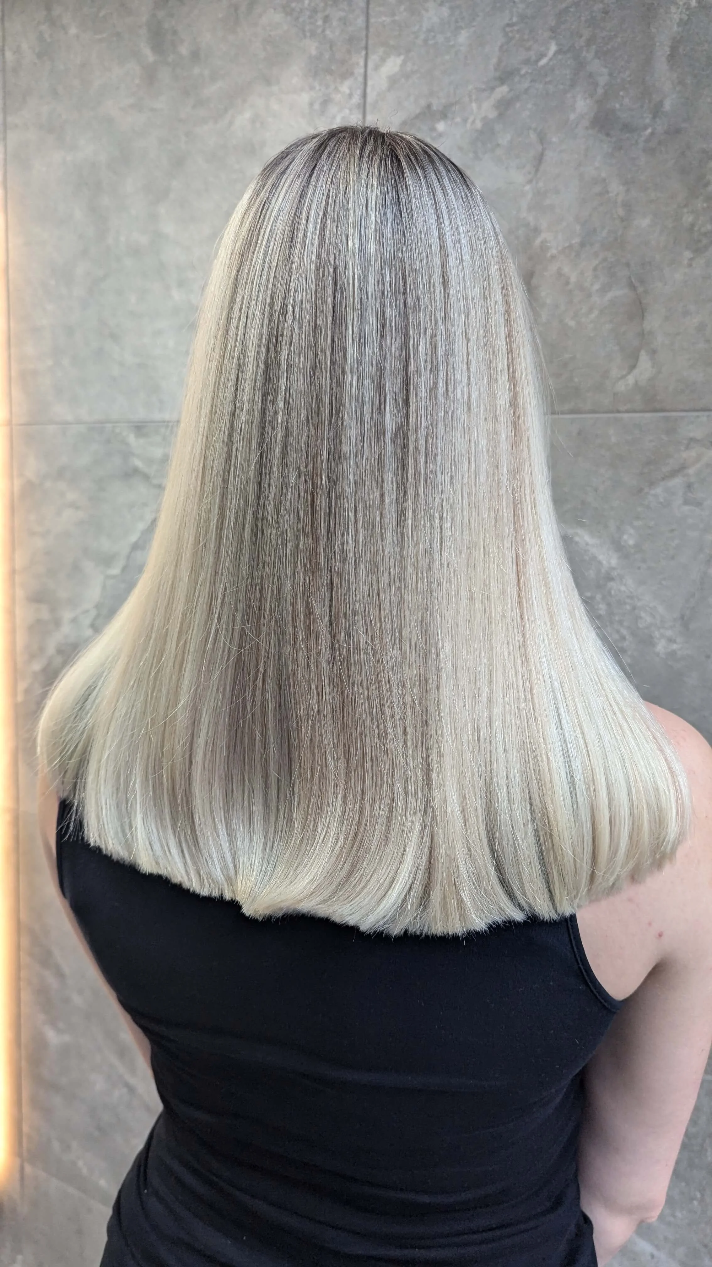 Best salon for hair color Vancouver—Platinum blonde coloring and sleek styling by Valos Hair Salon