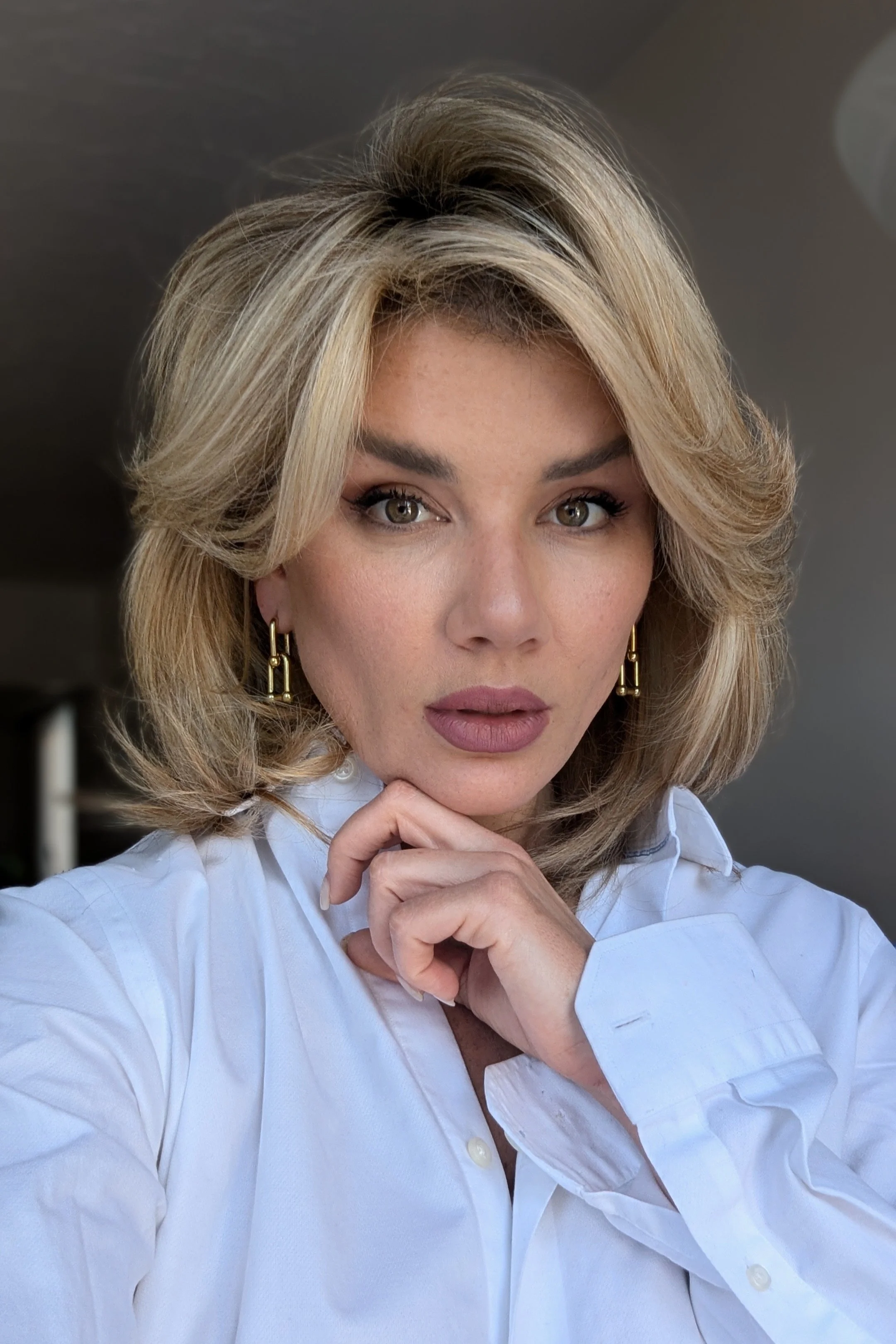 Larissa, Vancouver hairstylist and color specialist at Valos Hair Salon, showcasing voluminous blowout styling