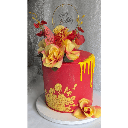 Custom birthday cake with gold drip design and floral accents made in Fort Washington by A Matter of Cake