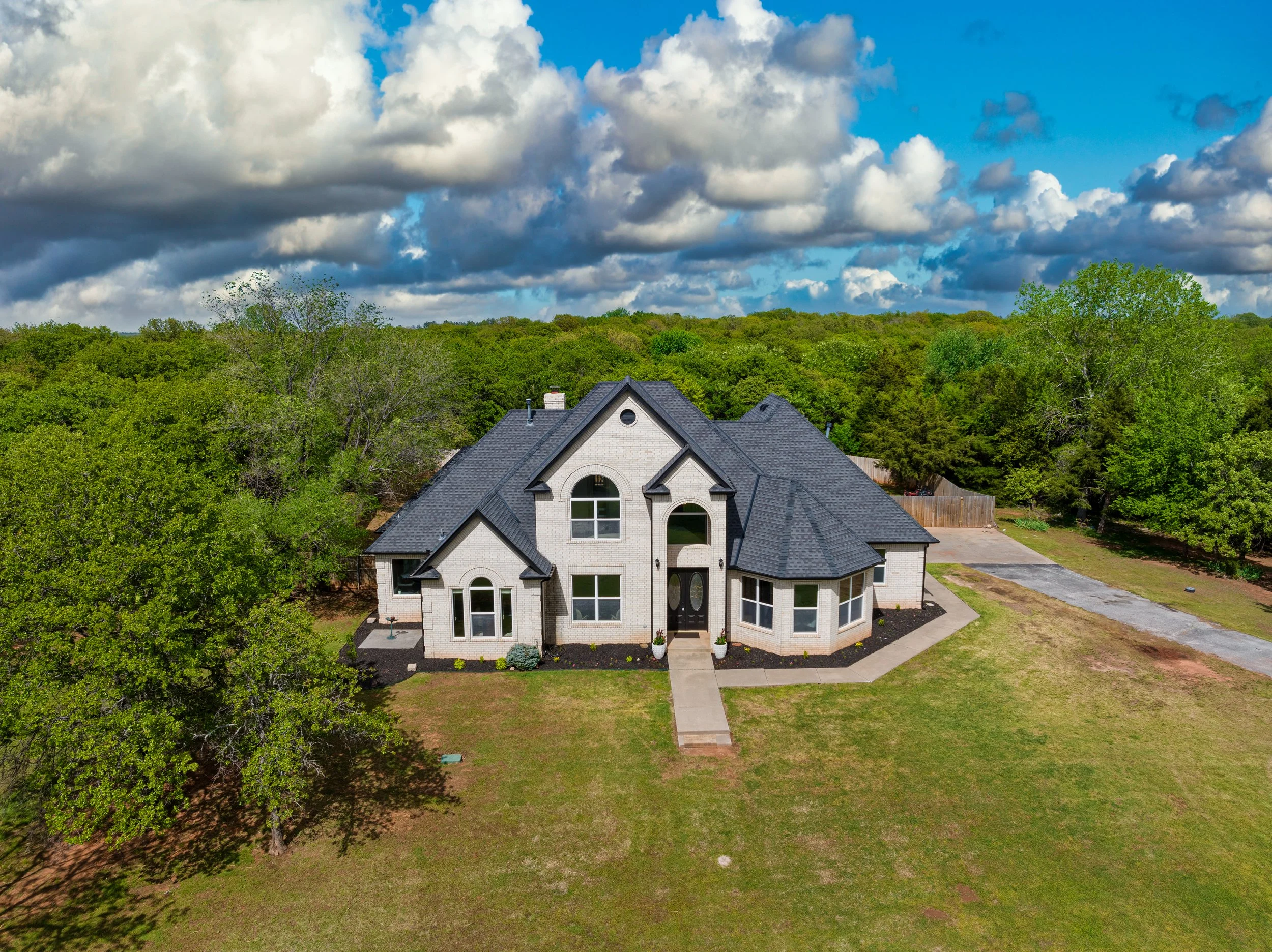 Aerial capture of this gorgeous Norman home located along Lake Thunderbird