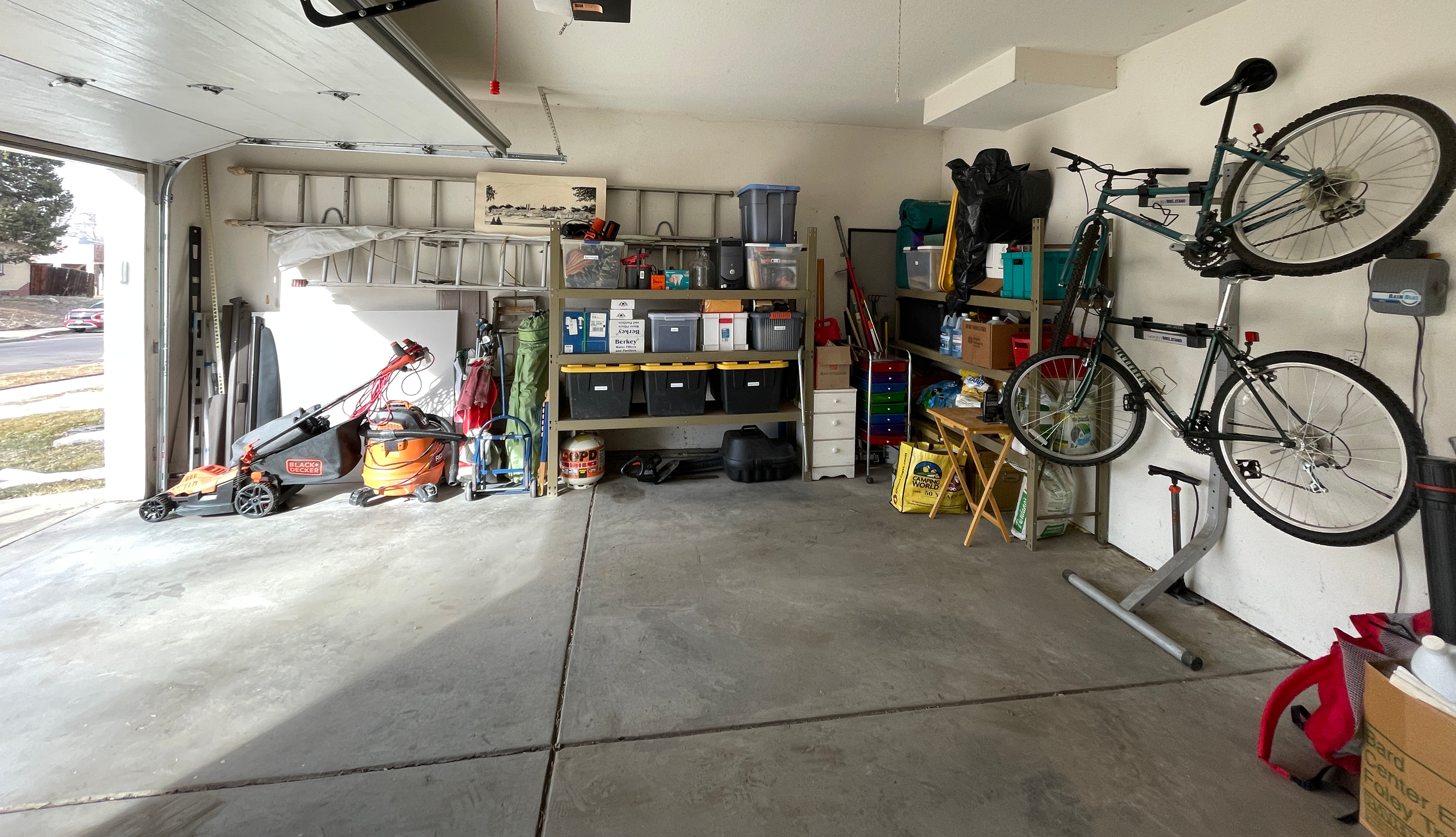 Professionally organized garage space with items clearly labeled and stored on shelves in Denver, CO.
