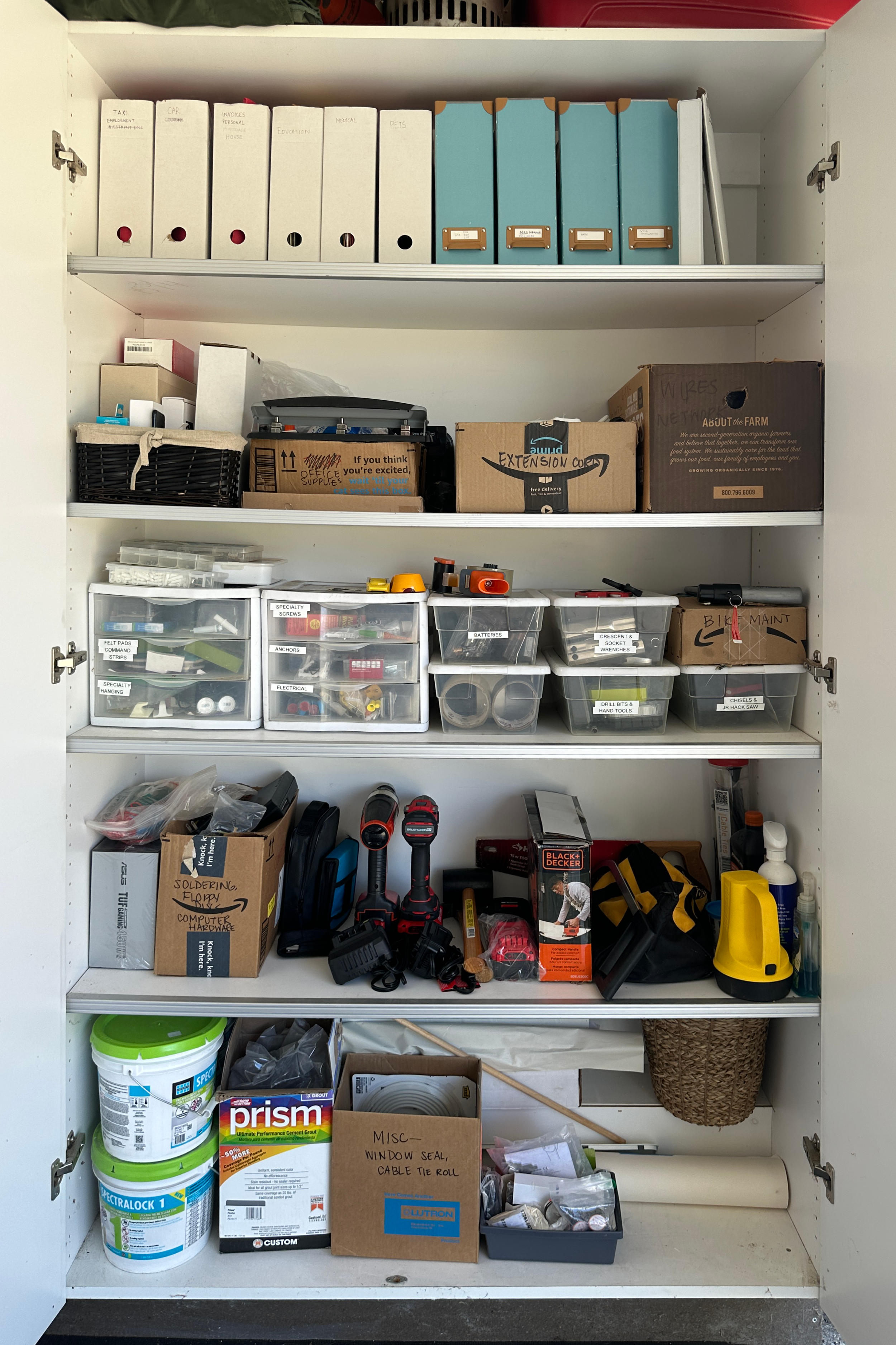 "After" of a white garage cupboard with a shelf of organized files, a shelf of professionally organized tools and home supplies, and more in Los Altos, California.
