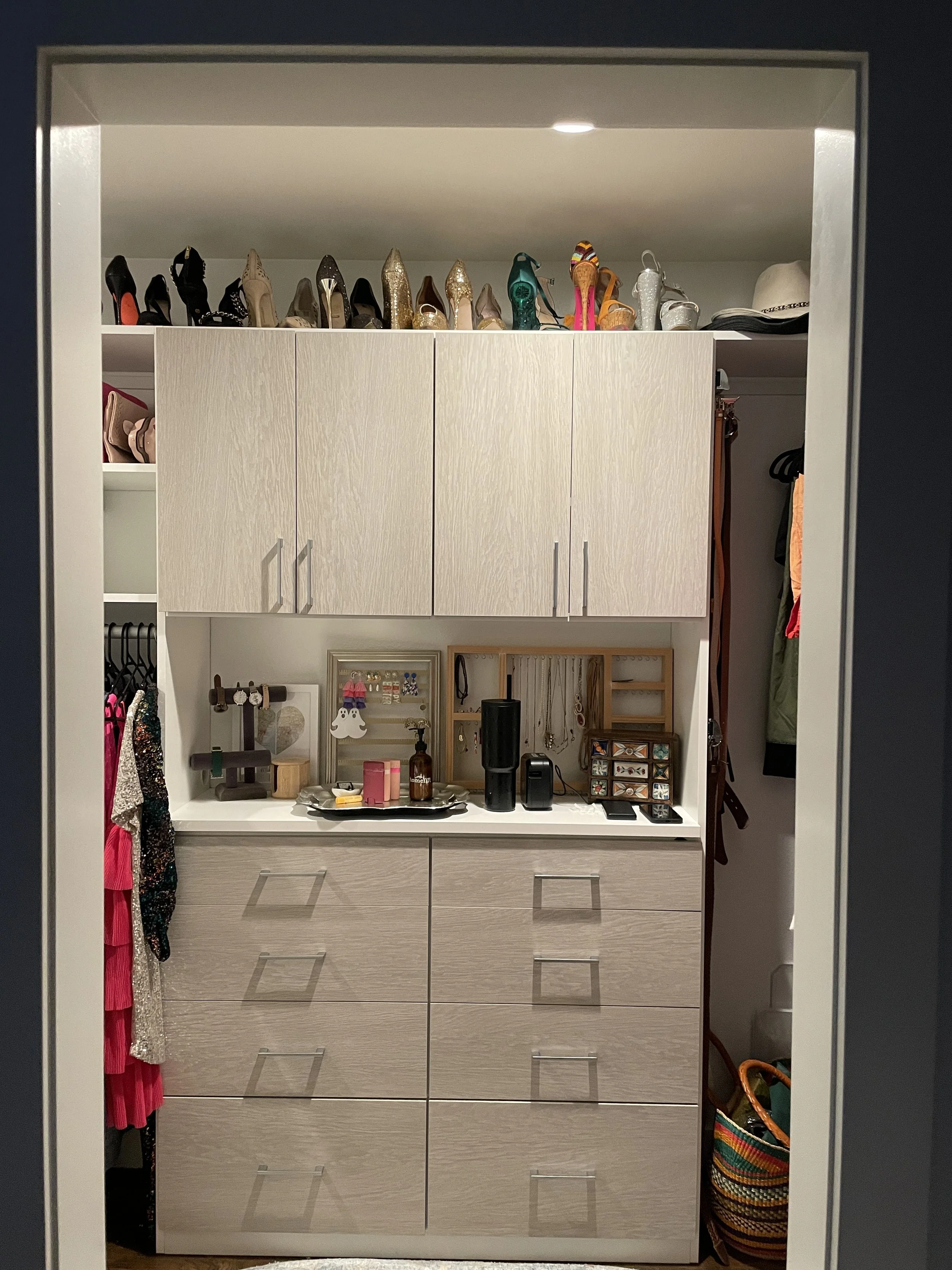 After image of an organized dresser with horizontal space reclaimed as a beauty station with makeup, jewelry, and accessories displayed.