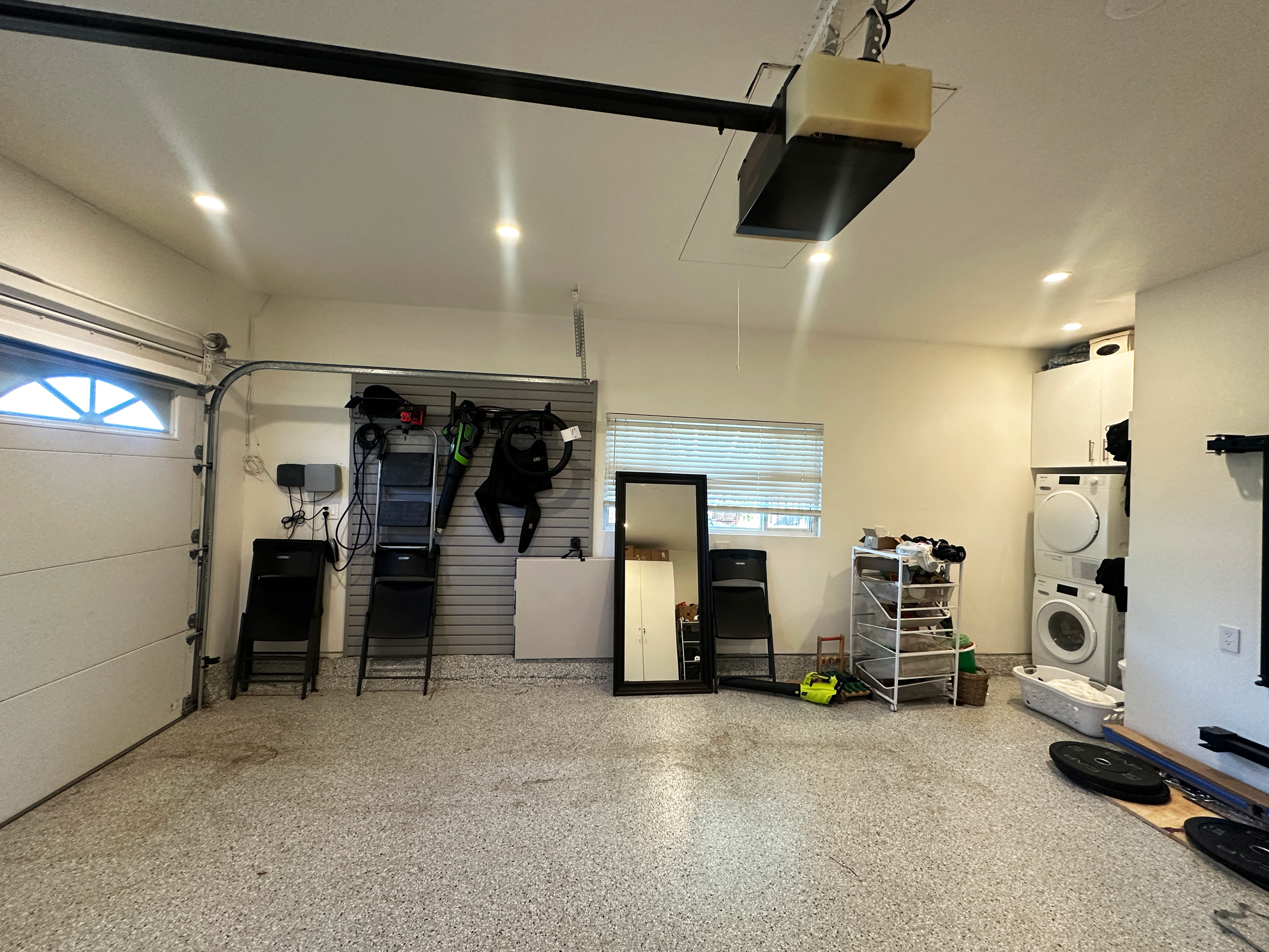 Before image of a sparse garage with cluttered areas in Los Altos, CA