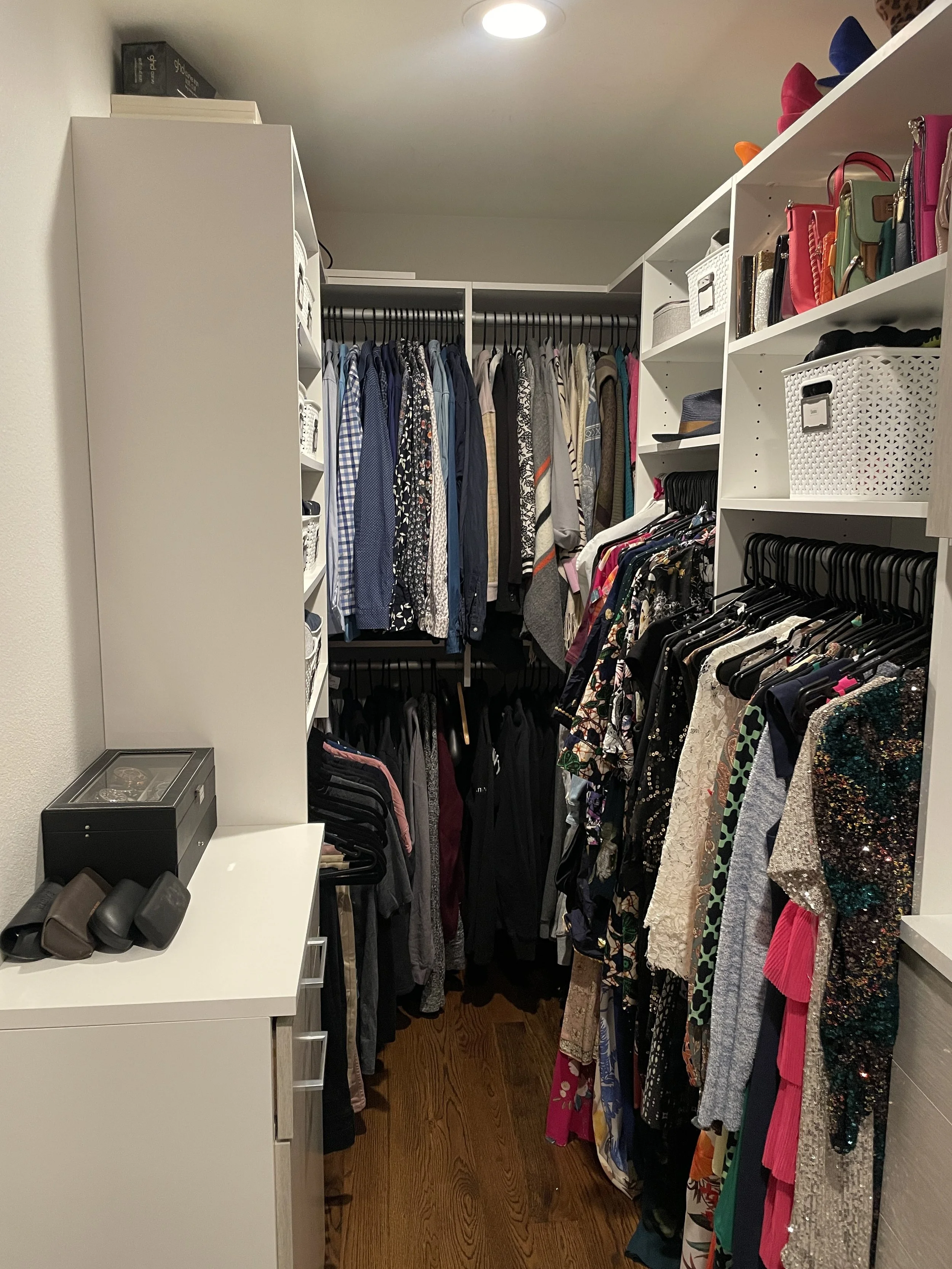 After image of a beautifully organized closet by Strategic Spaces that fully utilizes hanging space, has cleared horizontal surfaces, and is ready for shared use by husband and wife in Denver, CO.